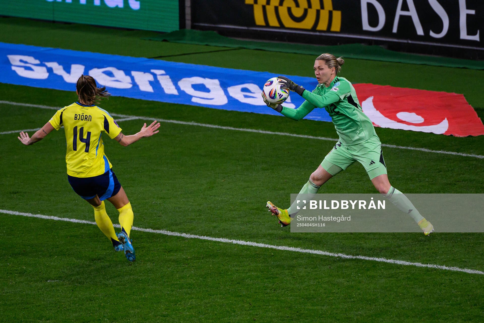 Nathalie Björn and goalkeeper Jennifer Falk of Sweden