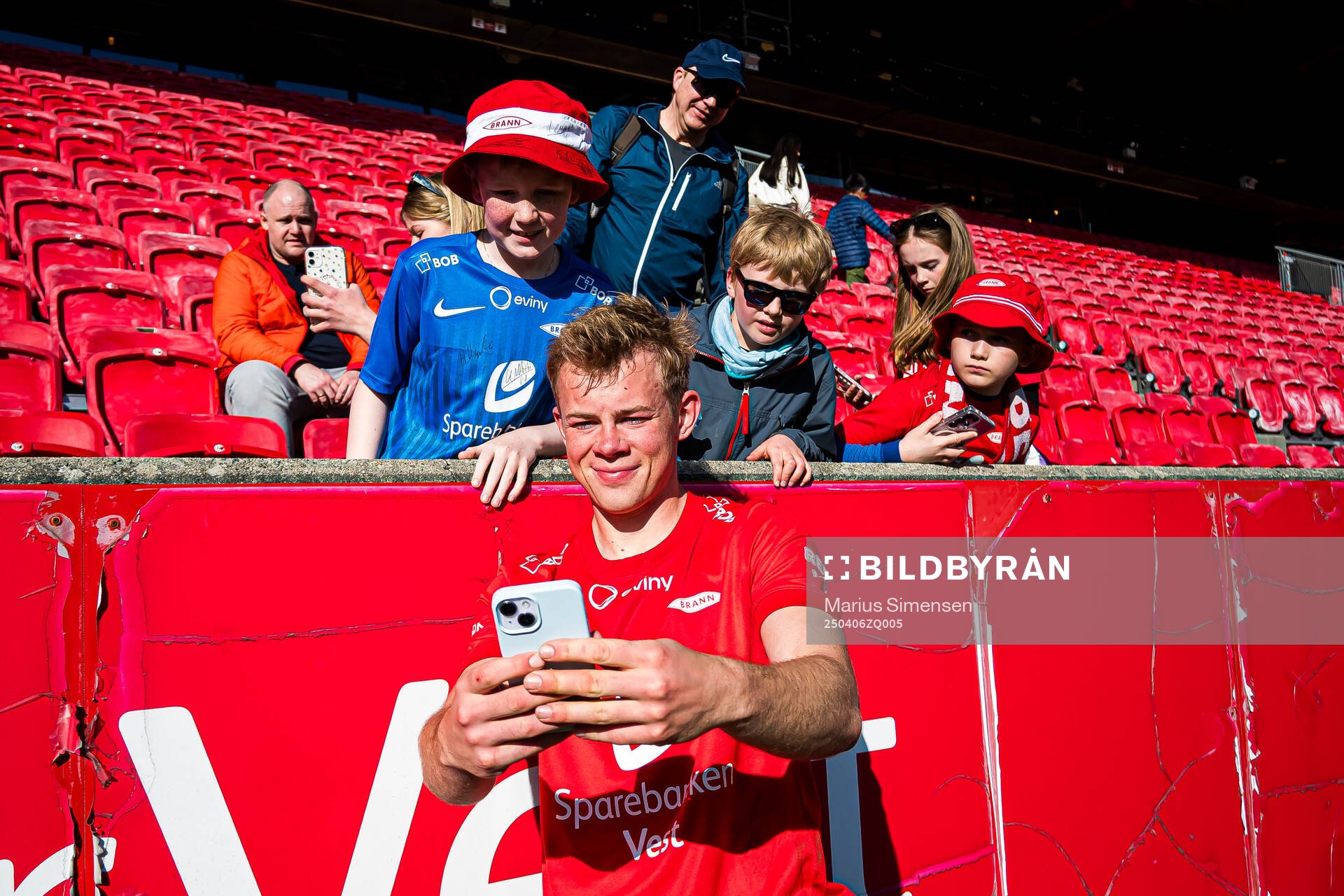 Aune Heggebø of Brann taking a selfie with a fan