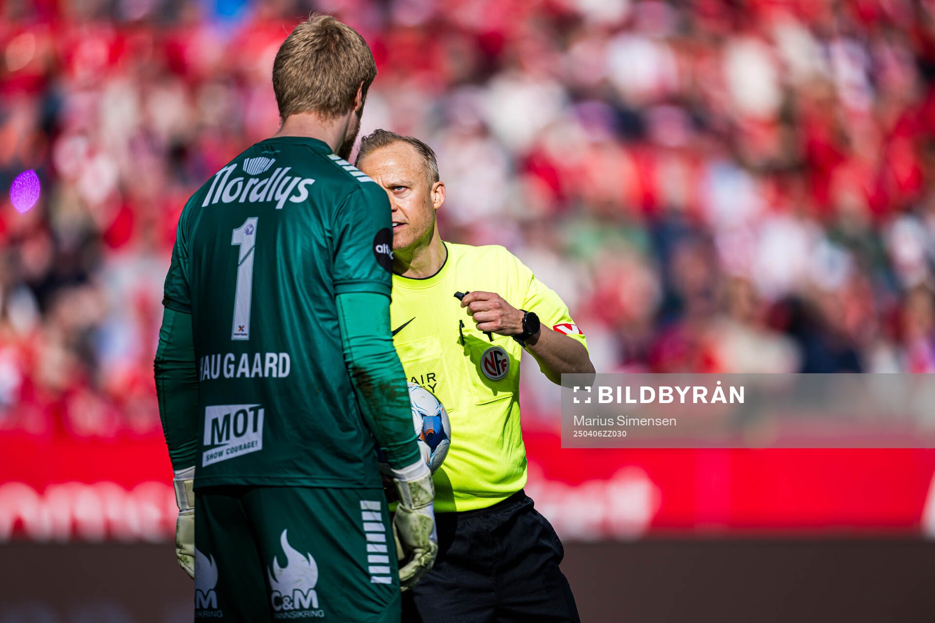 Jakob Let Haugaard of Tromsø and Ola Hobber Nilsen, referee, during the Eliteserien match between Brann and Tromsø on April 6, 2025 in Bergen. 