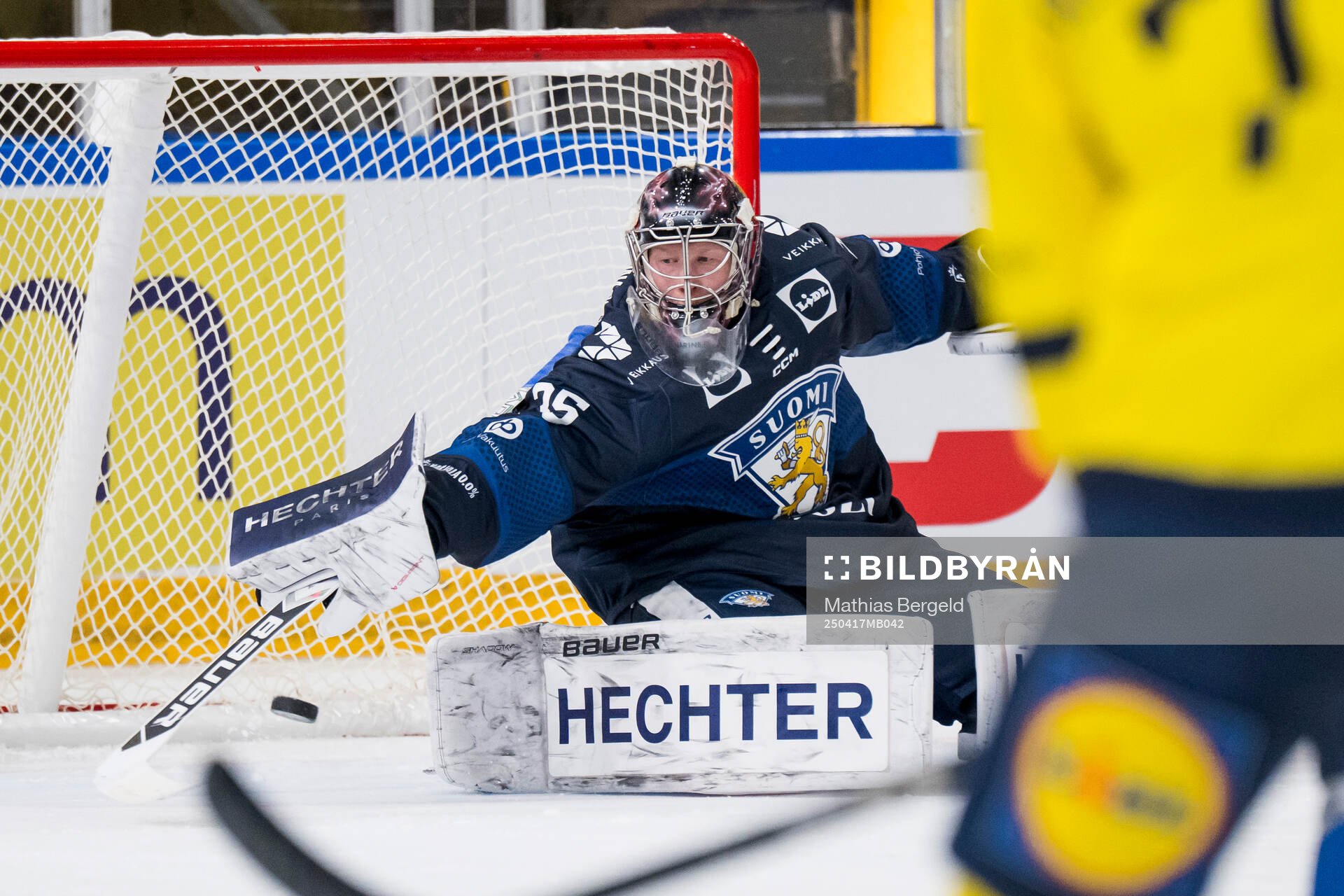 Goaltender Oskari Salminen of Finland