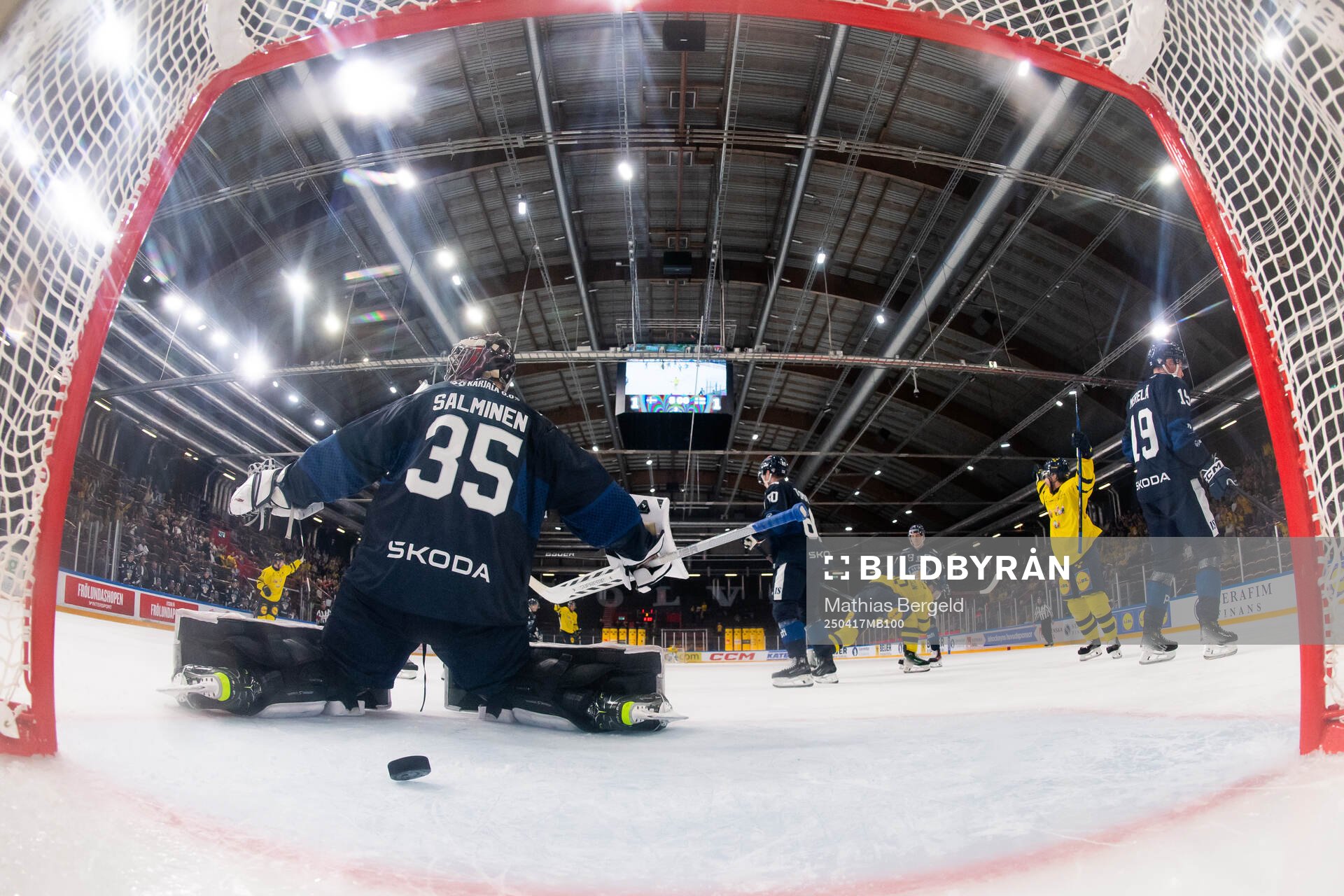 Goaltender Oskari Salminen of Finland looks dejected