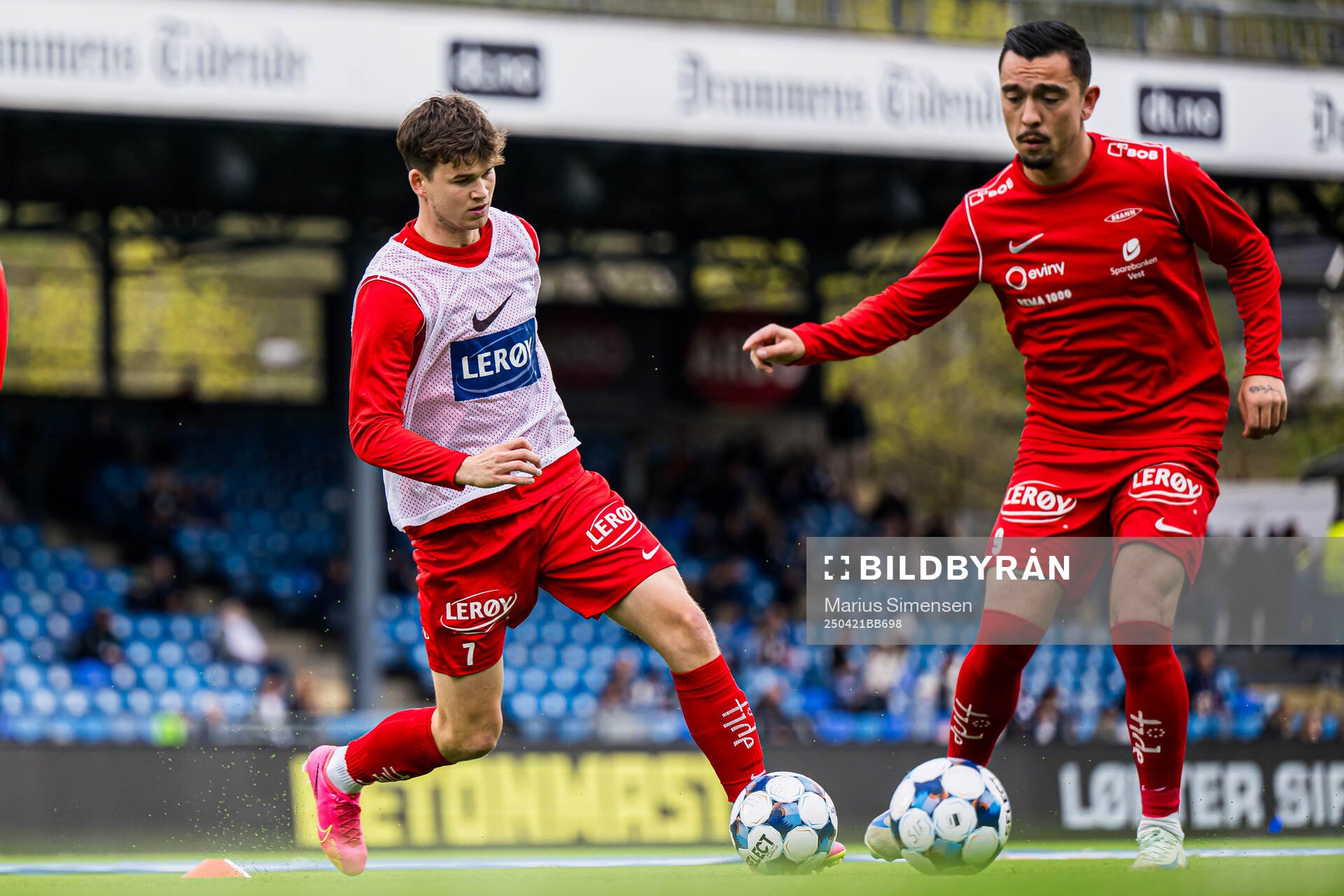 Mads Hansen and Niklas Castro of Brann warms up ahead of the Eliteserien match between Strømsgodset and Brann on April 21, 2025 in Drammen.