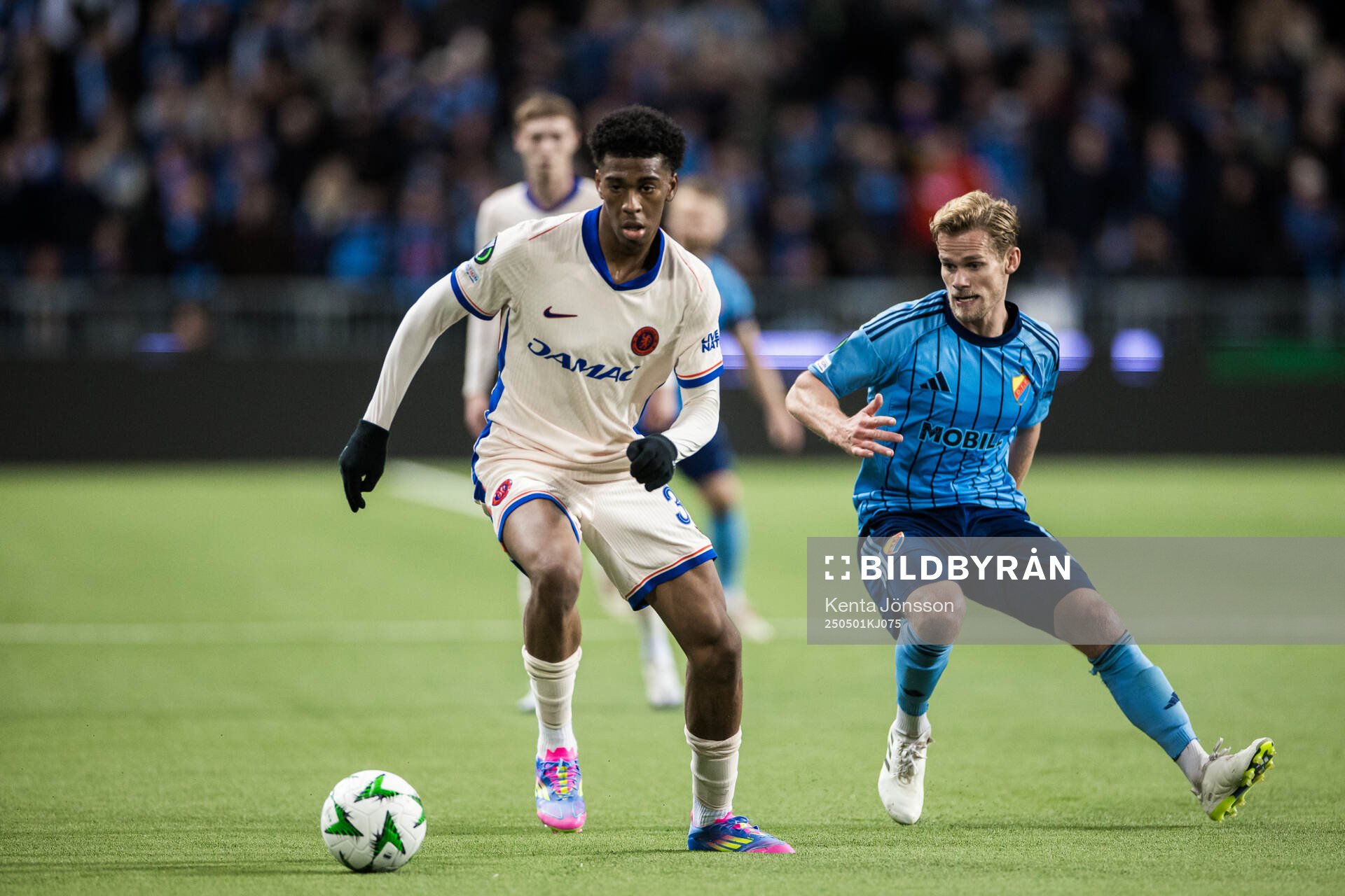 Joshua Acheampong of Chelsea and Hampus Finndell of Djurgården during the UEFA Conference League semifinal between Djurgården and Chelsea on May 1, 2025 in Stockholm.