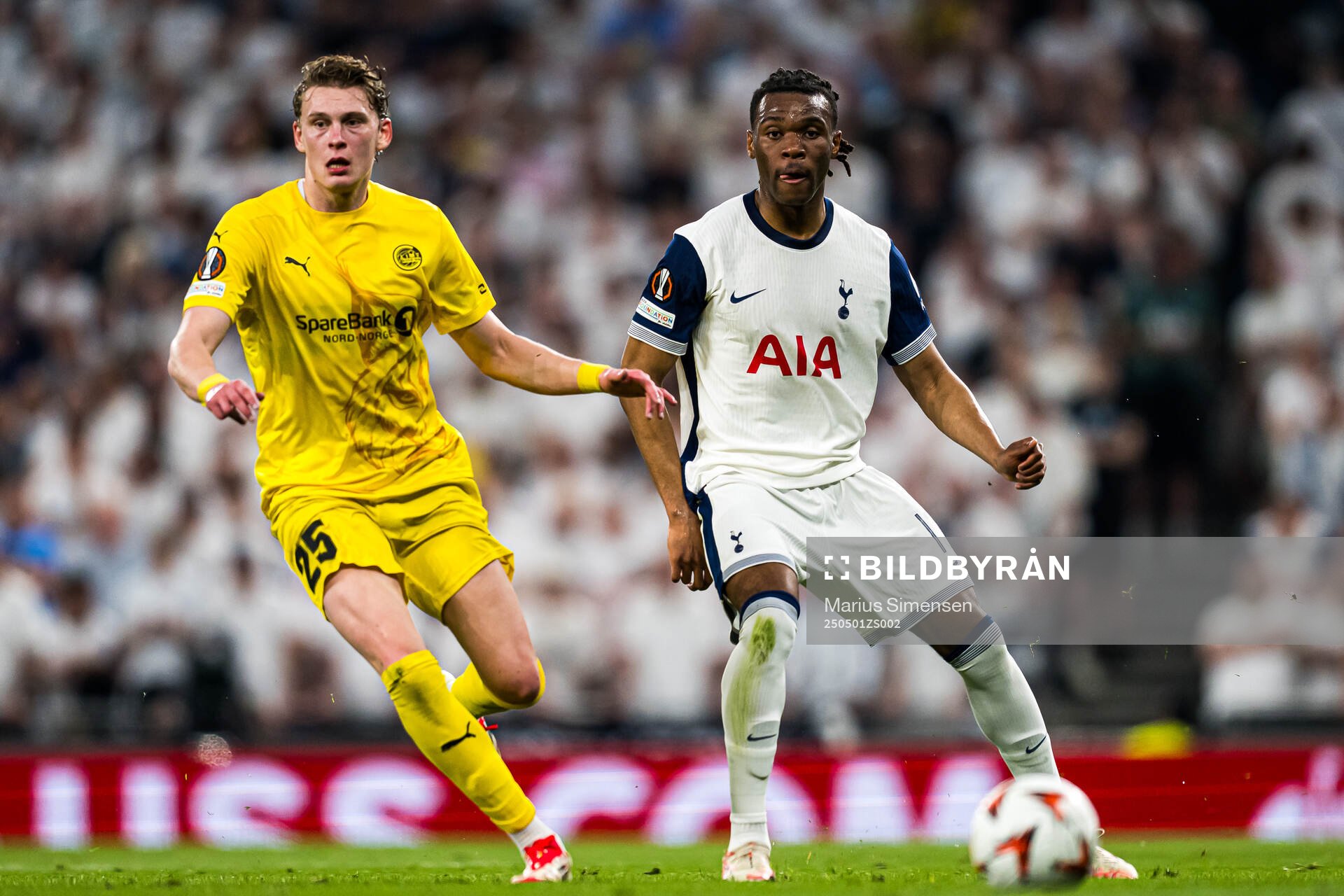 Isak Dybvik Määttä of Bodø/Glimt and Destiny Udogie of Tottenham during the UEFA Europa League semi-final football match between Tottenham and Bodø/Glimt on May 1, 2025 in London.