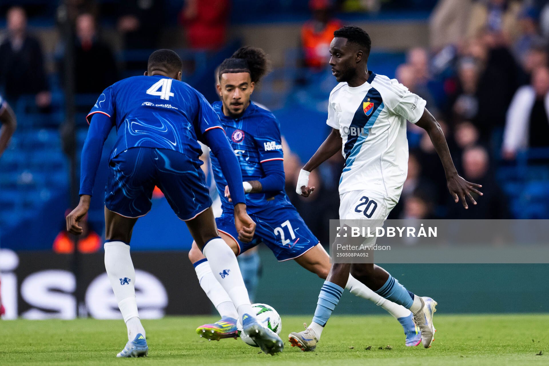 Malo Gusto of Chelsea and Tokmac Nguen of Djurgården during the UEFA Conference League semifinal second leg match between Chelsea and Djurgården on May 8, 2025 in London.