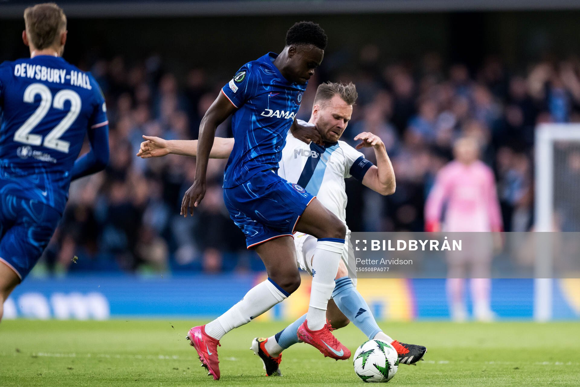 Tyrique George of Chelsea and Jacob Une of Djurgården during the UEFA Conference League semifinal second leg match between Chelsea and Djurgården on May 8, 2025 in London.