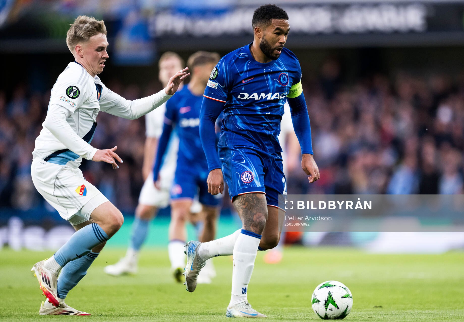 Viktor Bergh of Djurgården and Trevoh Chalobah of Chelsea during the UEFA Conference League semifinal second leg match between Chelsea and Djurgården on May 8, 2025 in London.