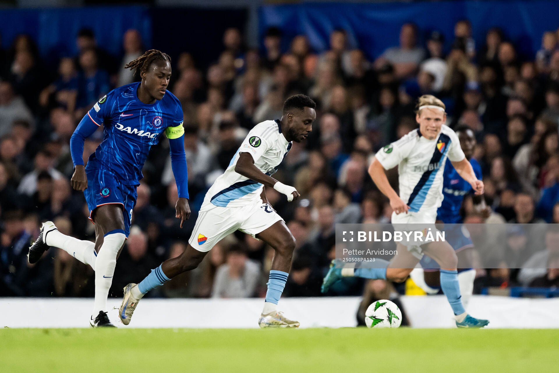 Trevoh Chalobah of Chelsea and Tokmac Nguen of Djurgården during the UEFA Conference League semifinal second leg match between Chelsea and Djurgården on May 8, 2025 in London.