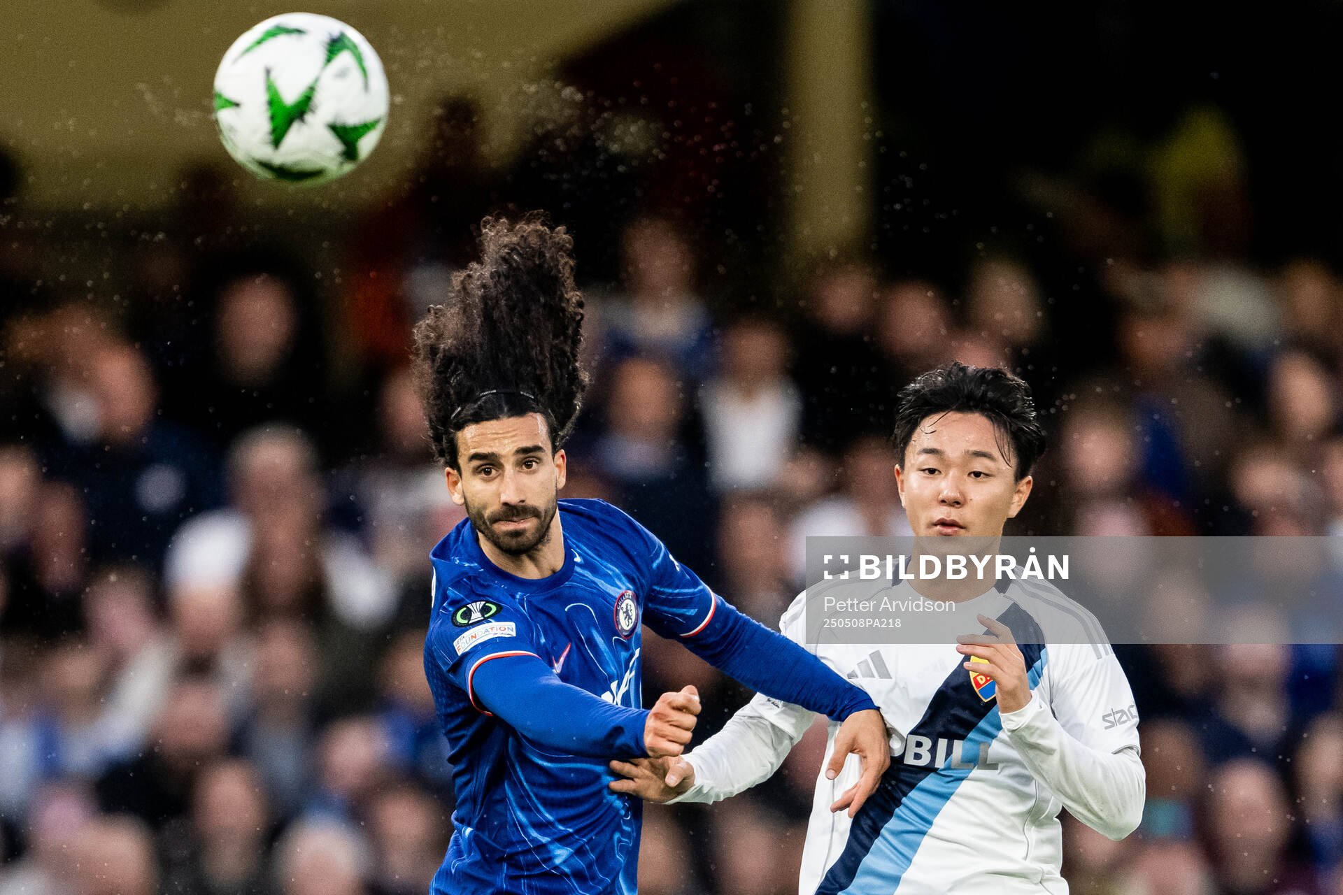 Marc Cucurella of Chelsea and Keita Kosugi of Djurgården during the UEFA Conference League semifinal second leg match between Chelsea and Djurgården on May 8, 2025 in London.
