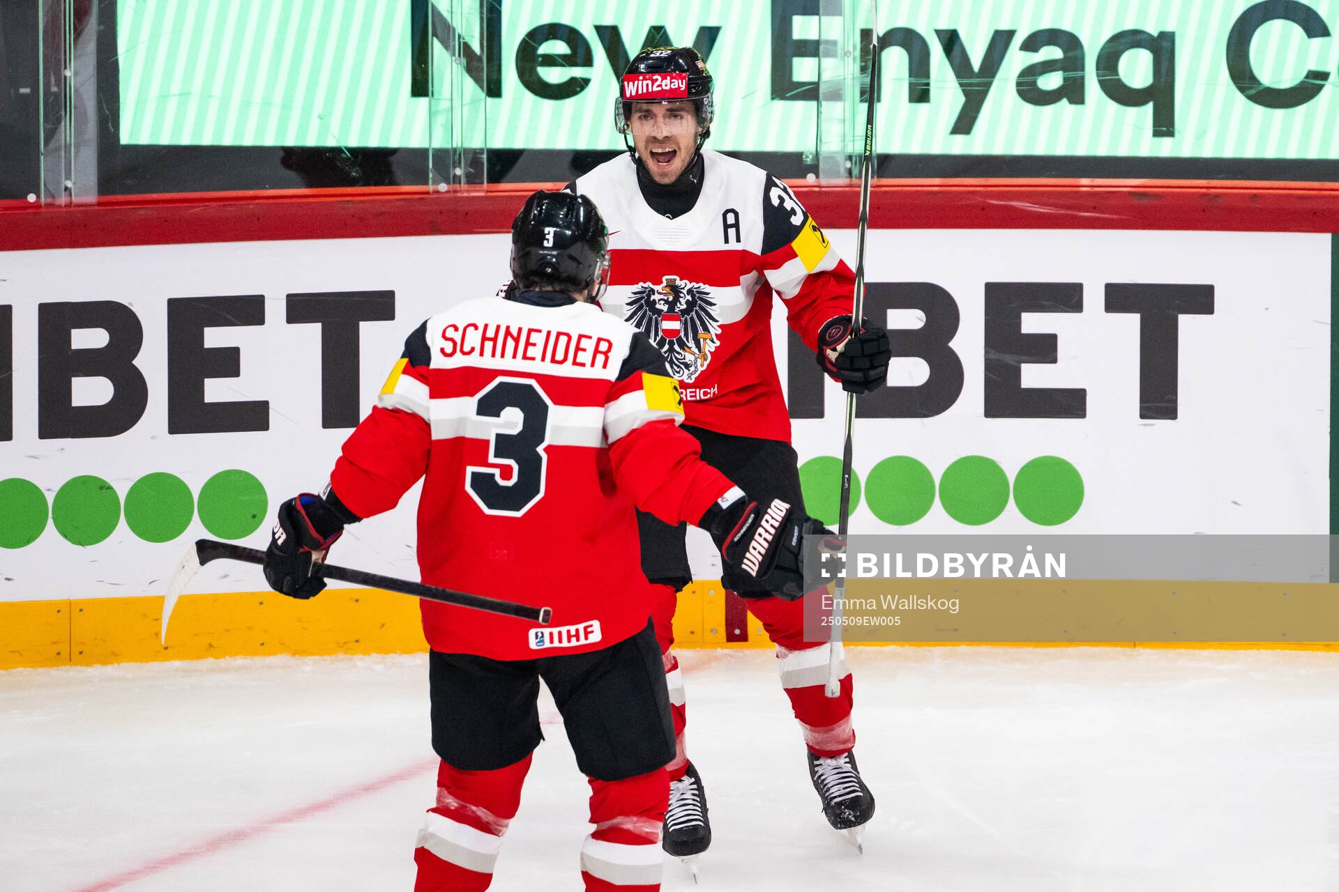 Bernd Wolf of Austria celebrates with Peter Schneider