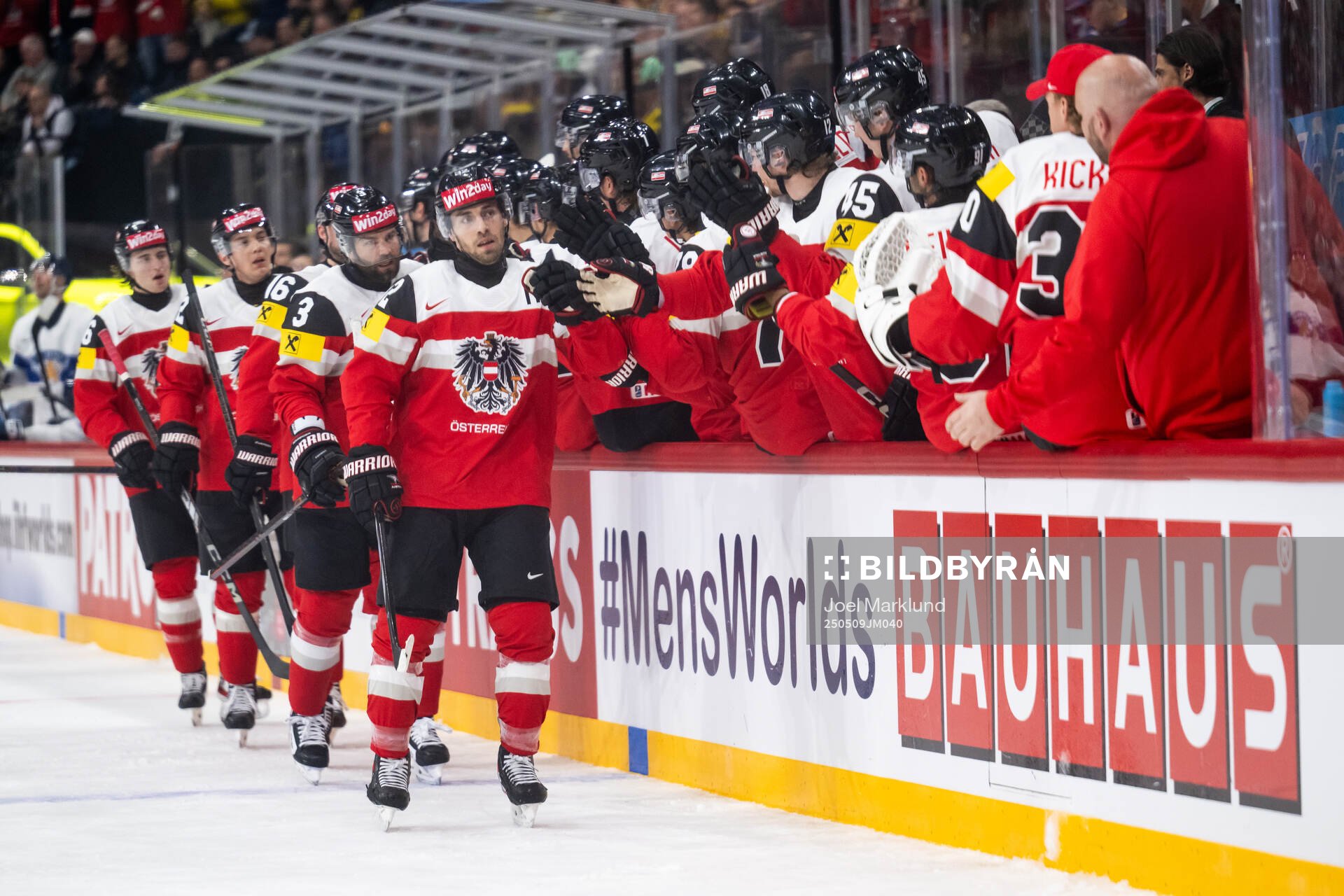 Bernd Wolf of Austria celebrates with team mates