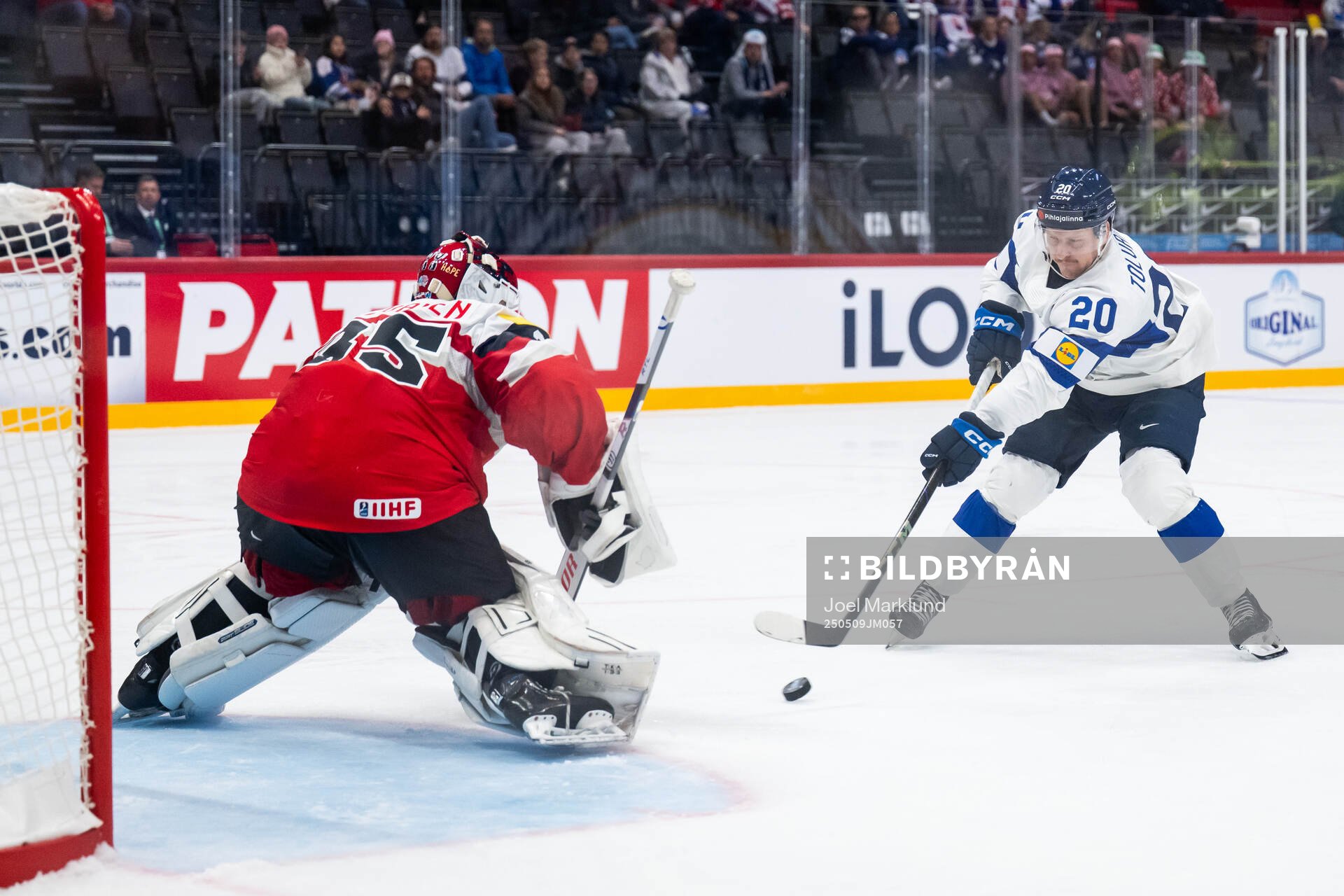 Goaltender Atte Tolvanen of Austria and Eeli Tolvanen of