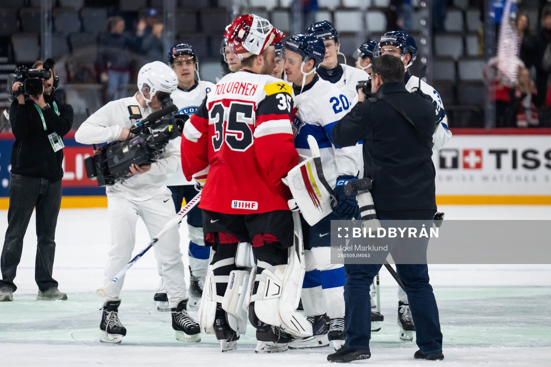 Goaltender Atte Tolvanen of Austria with Eeli Tolvanen of