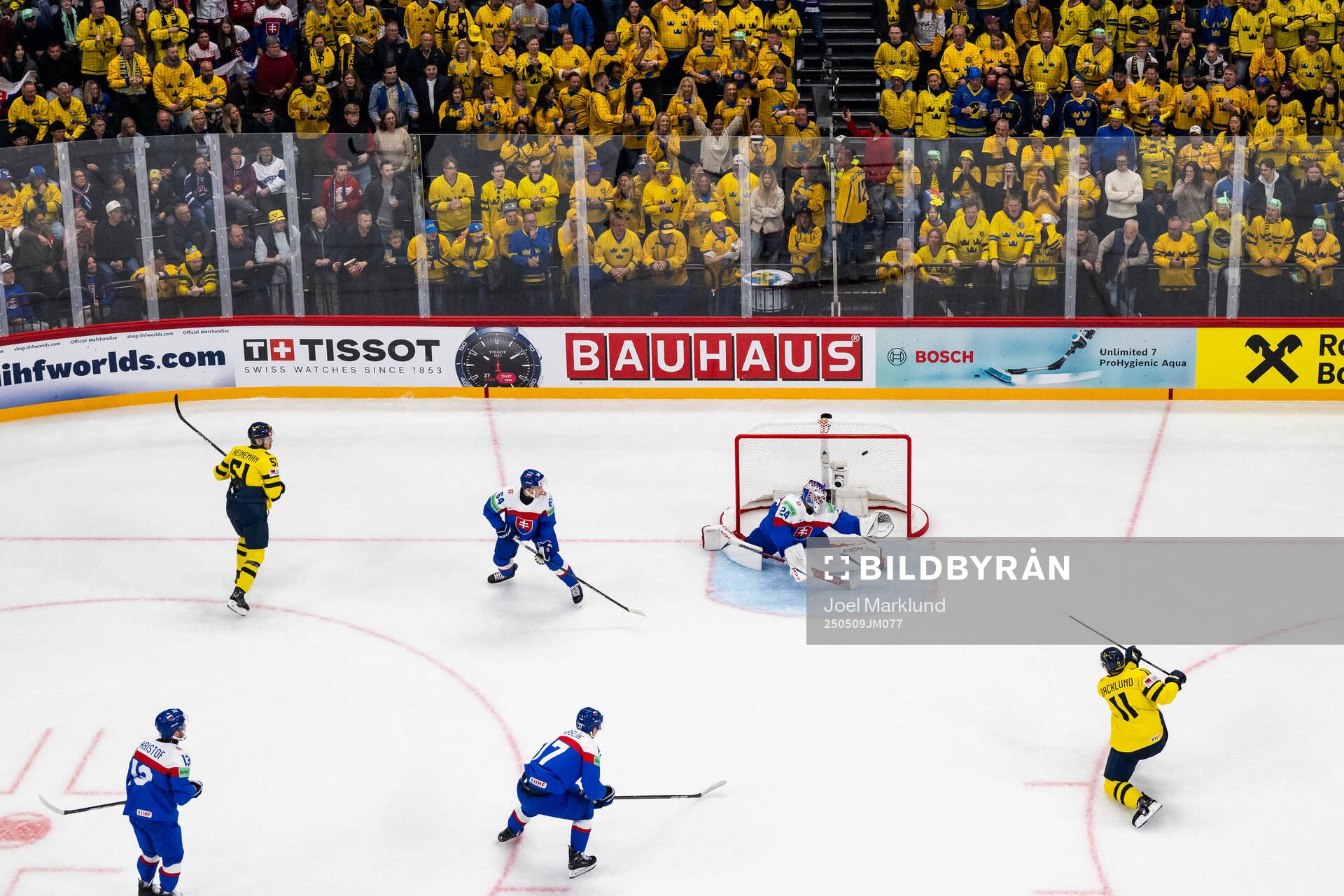 Mikael Backlund of Sweden scores 1-0 behind goaltender