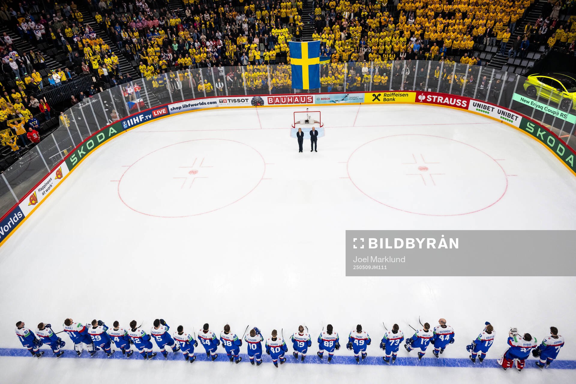 Players of Slovakia as the Swedish flag is raised and the