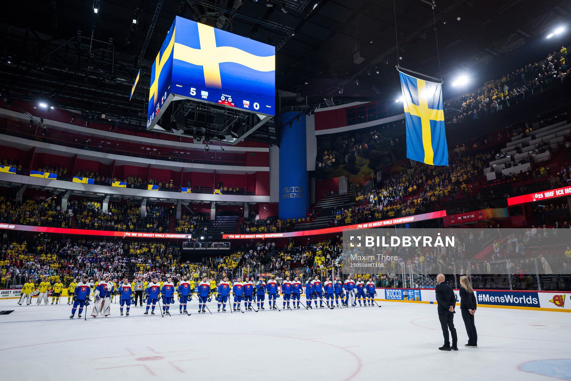 Players of Sweden and of Slovakia as the Swedish flag is