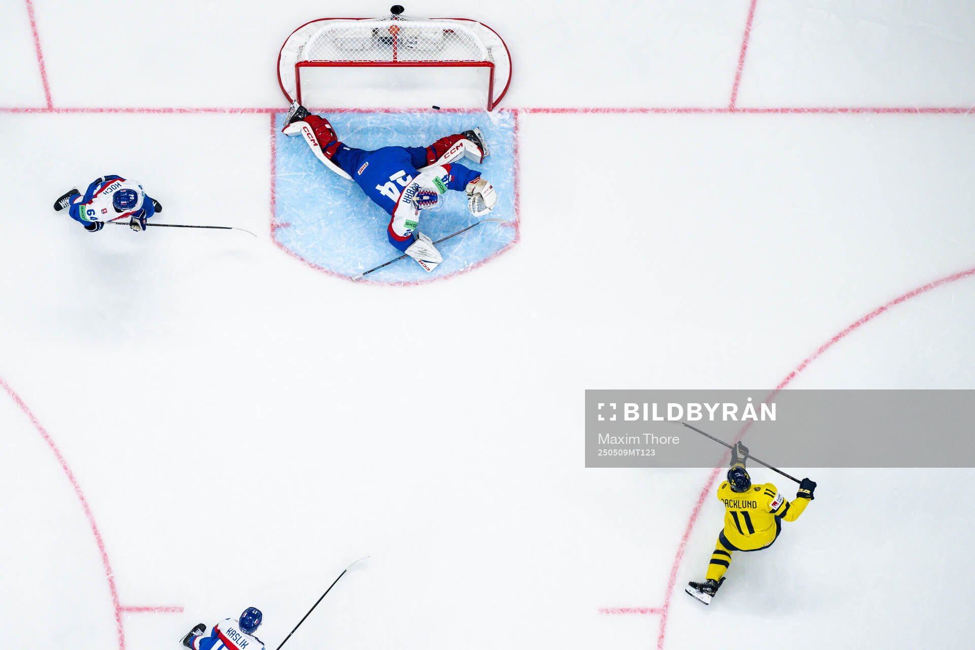 Mikael Backlund of Sweden scores the 1-0 goal behind