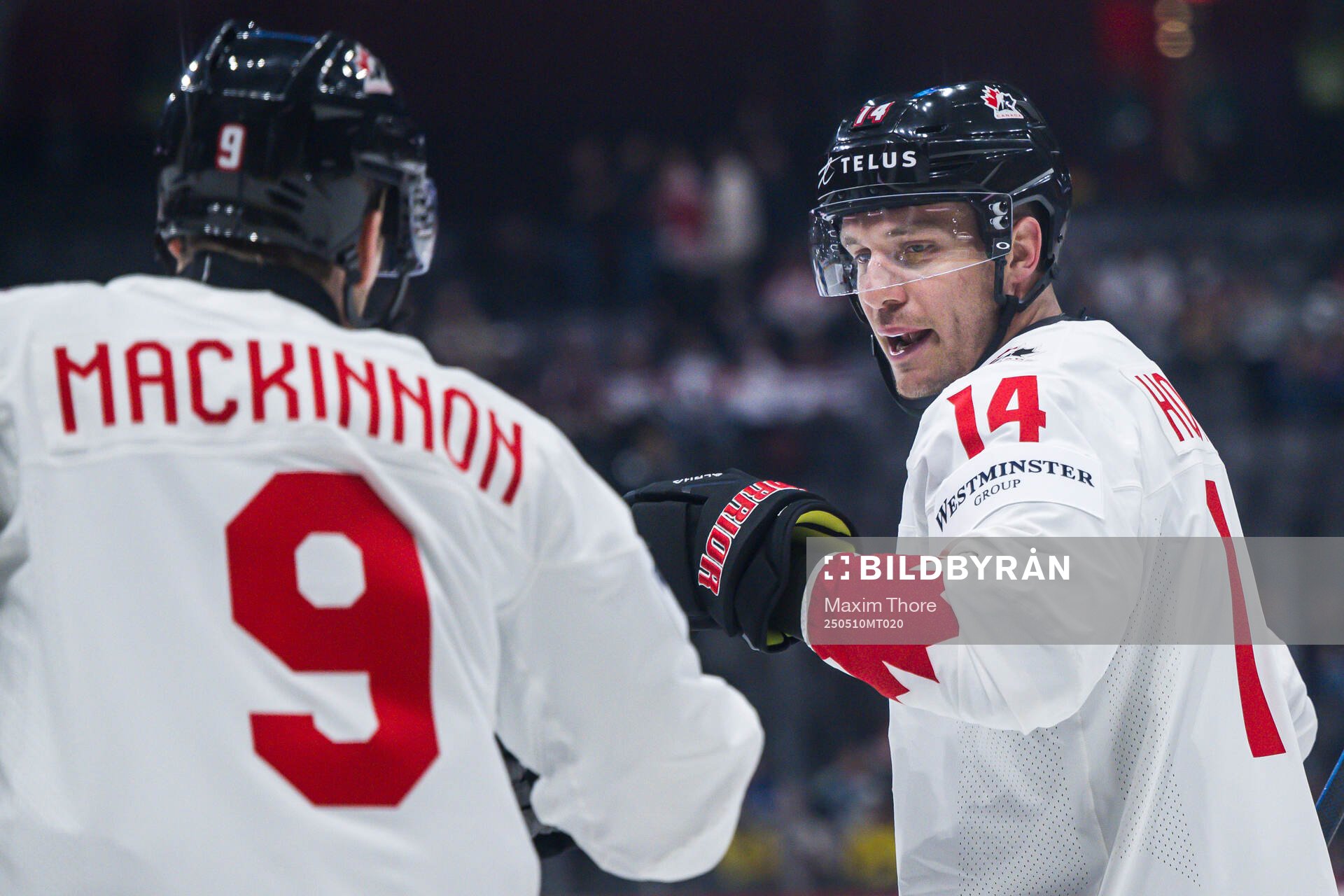 Nathan MacKinnon and Bo Horvat of Canada celebrate