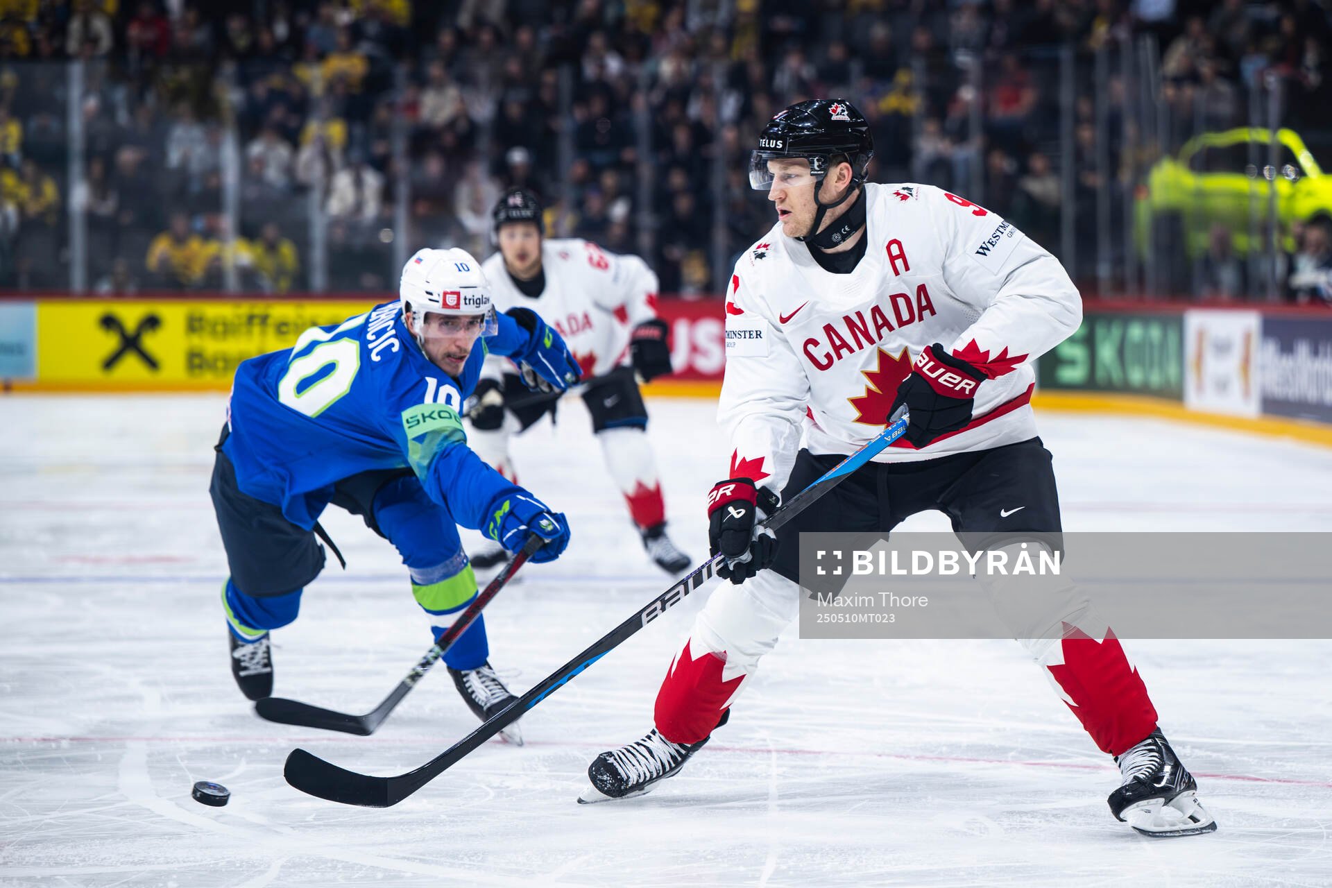 Miha Bericic of Slovenia and Nathan MacKinnon of Canada