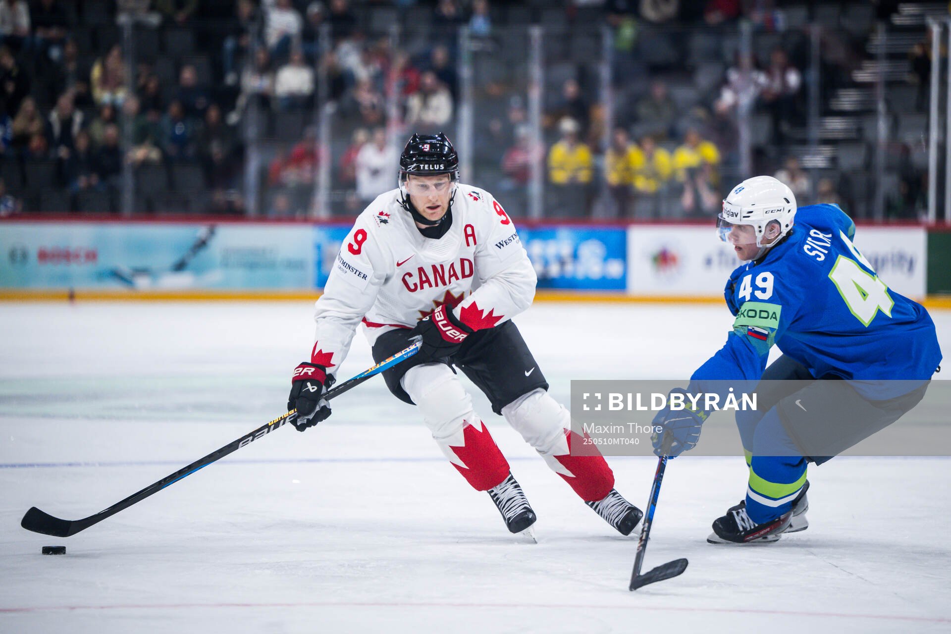 Nathan MacKinnon of Canada and Filip Sitar of Slovenia