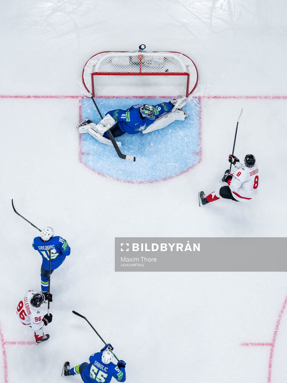 Noah Dobson of Canada scores the 0-4 goal behind goalkeeper