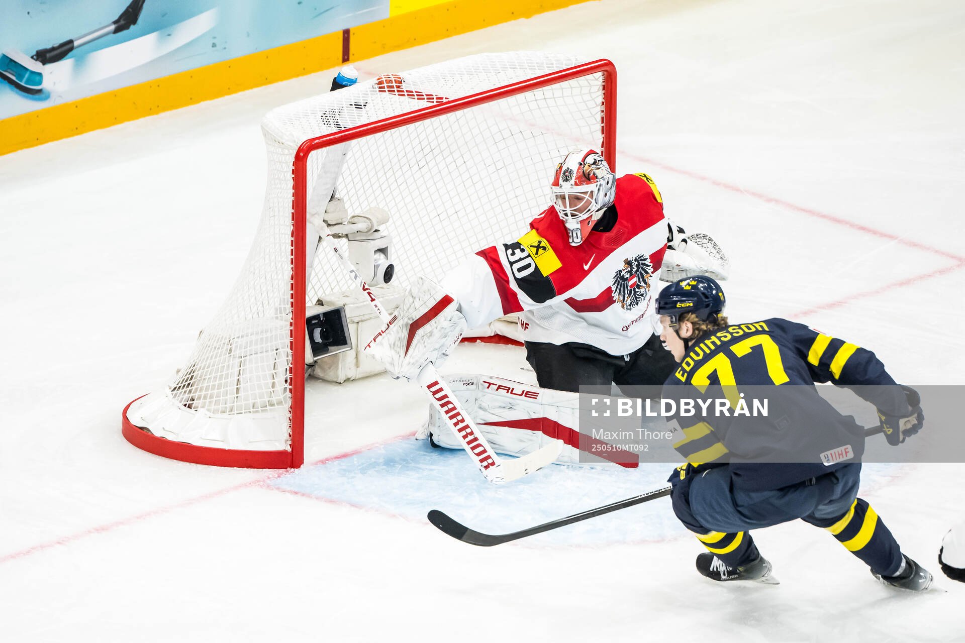 Goaltender David Kickert of Austria and Simon Edvinsson of