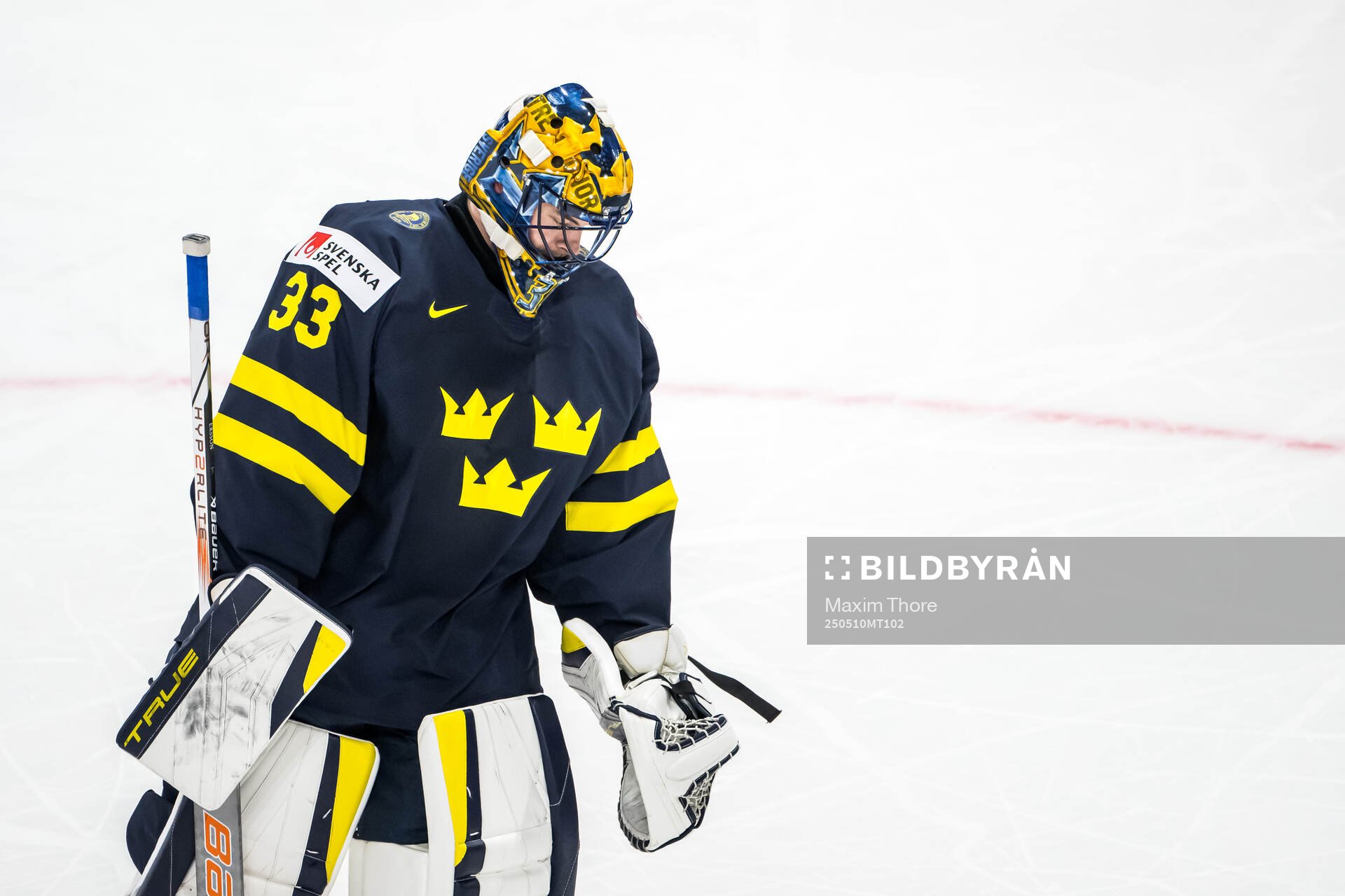 Goaltender Samuel Ersson of Sweden looks dejected