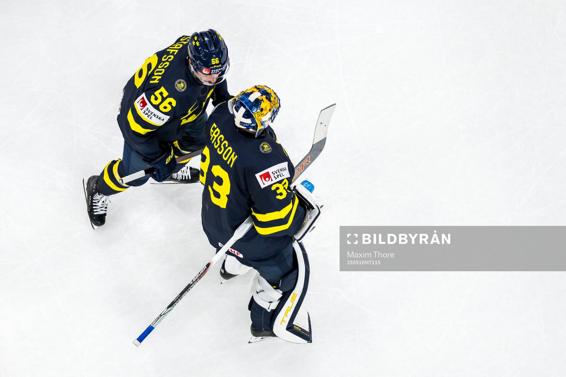 Erik Gustafsson and goaltender Samuel Ersson of Sweden