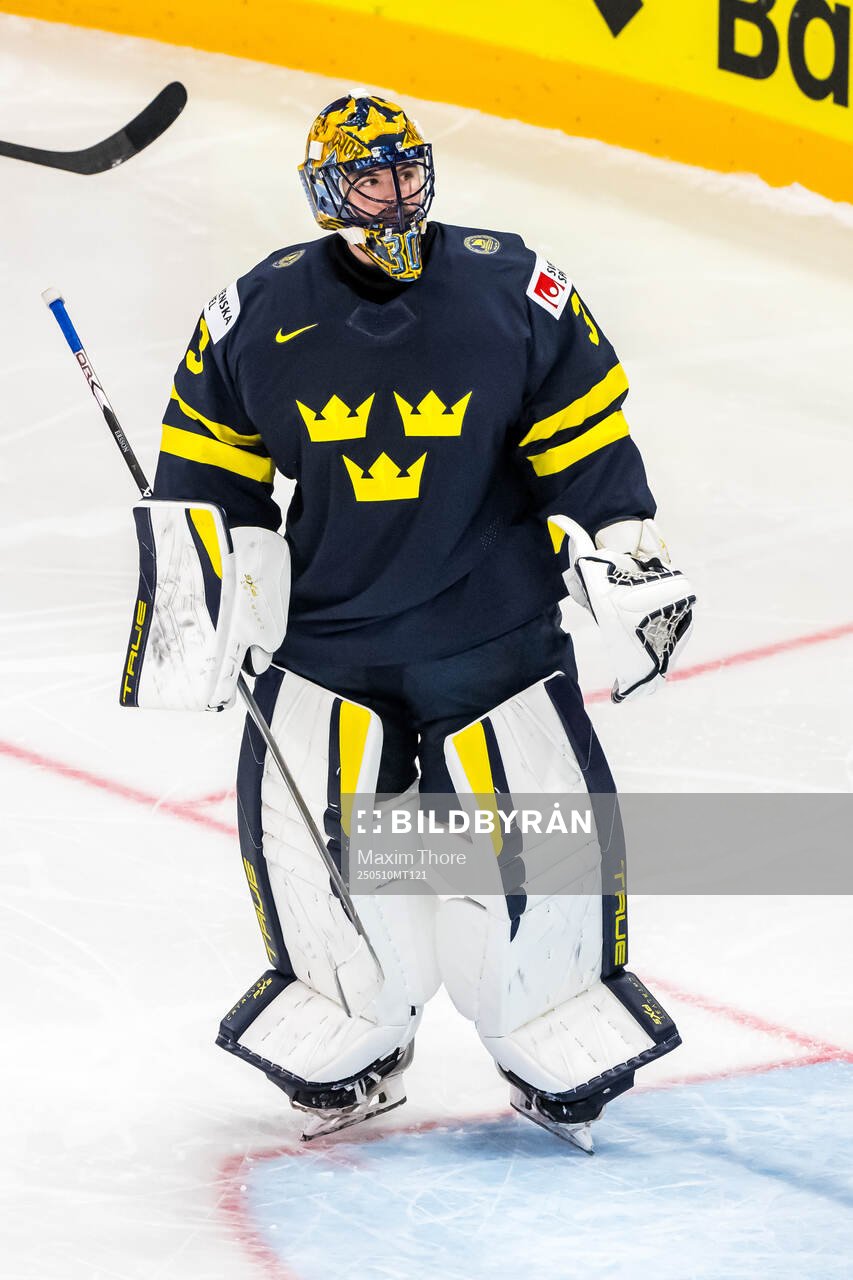 Goaltender Samuel Ersson of Sweden looks dejected