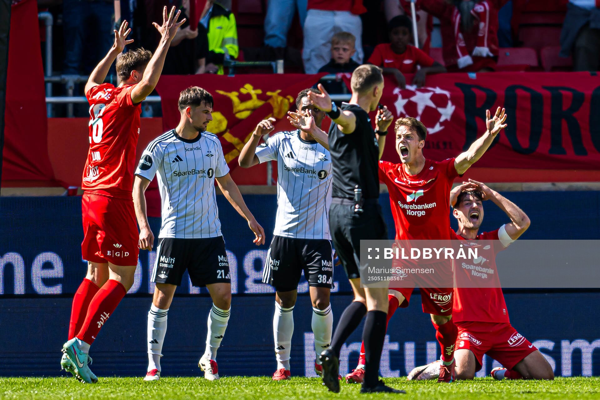 Felix Horn Myhre of Brann and Fredrik Pallesen Knudsen of Brann reacts on Marius Hansen Grøtta, referee, during the Eliteserien match between Brann and Rosenborg on May 11, 2025 in Bergen.