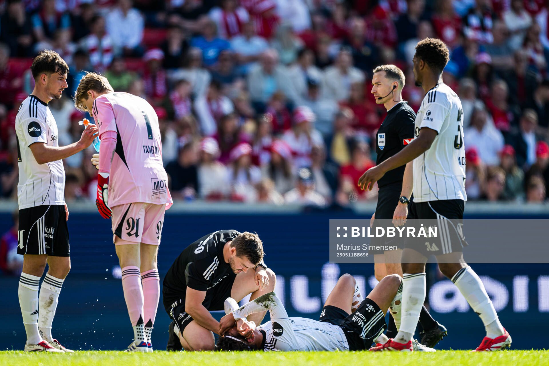 Adrian Nilsen Pereira of Rosenborg in pain during the Eliteserien match between Brann and Rosenborg on May 11, 2025 in Bergen. 