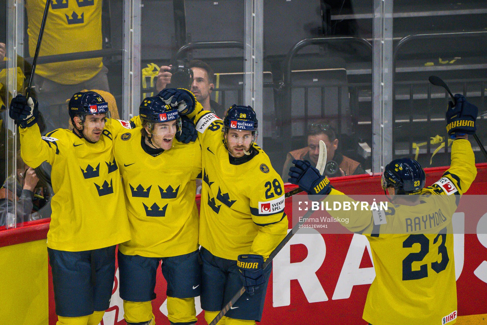 Mikael Backlund and Elias Lindholm celebrate with Leo