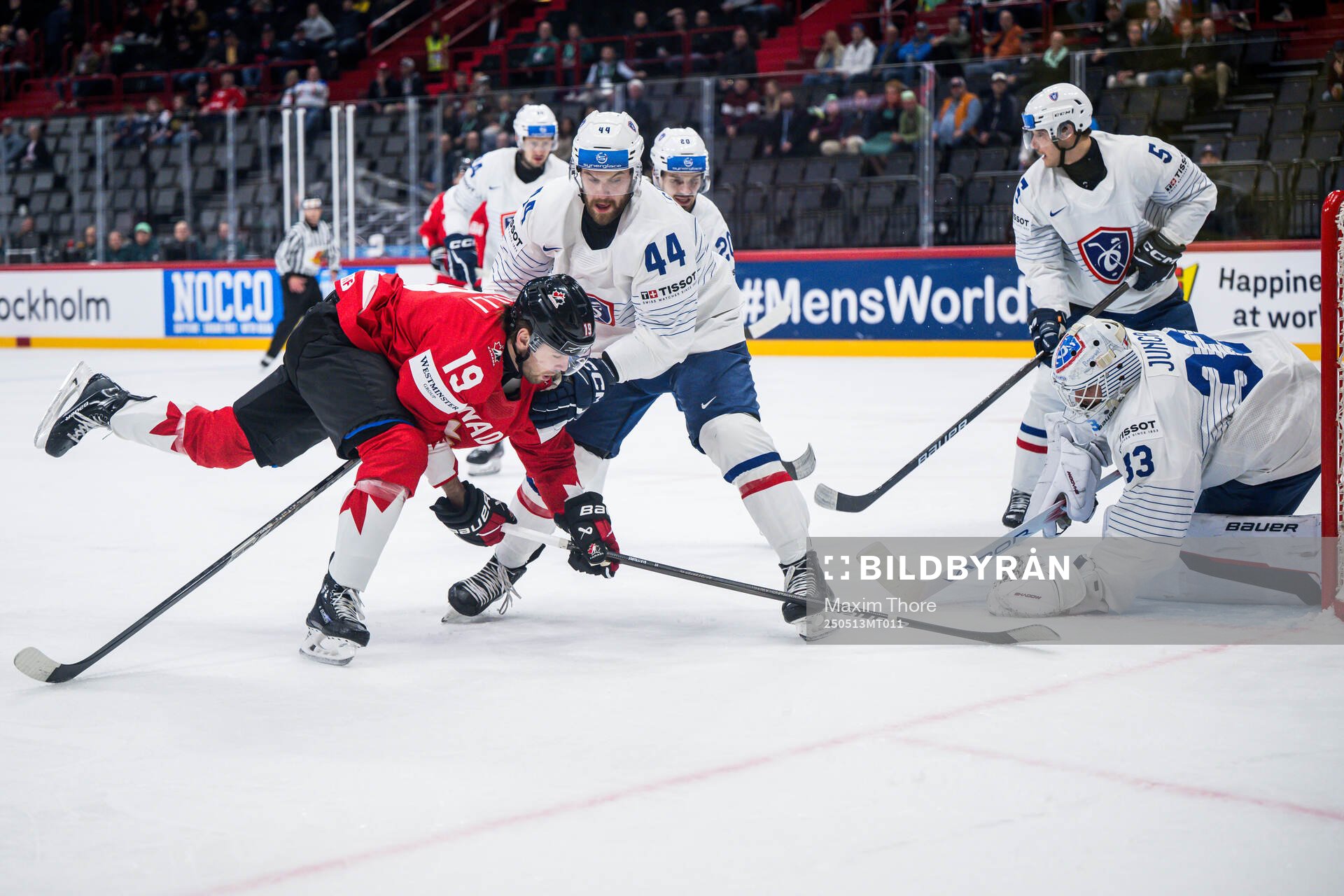 Adam Fantilli of Canada against Kevin Spinozzi and