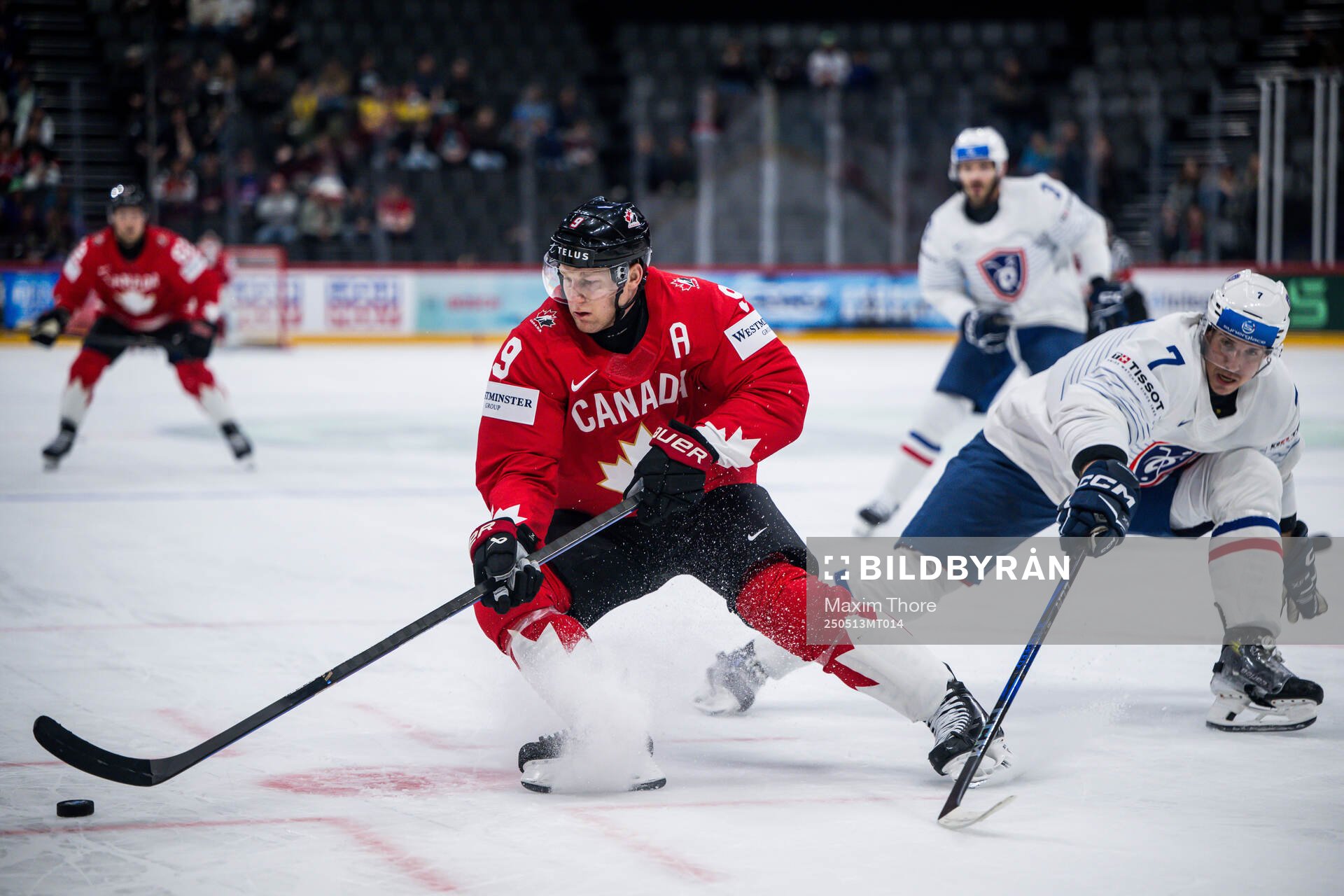 Nathan MacKinnon of Canada and Pierre Crinon of France