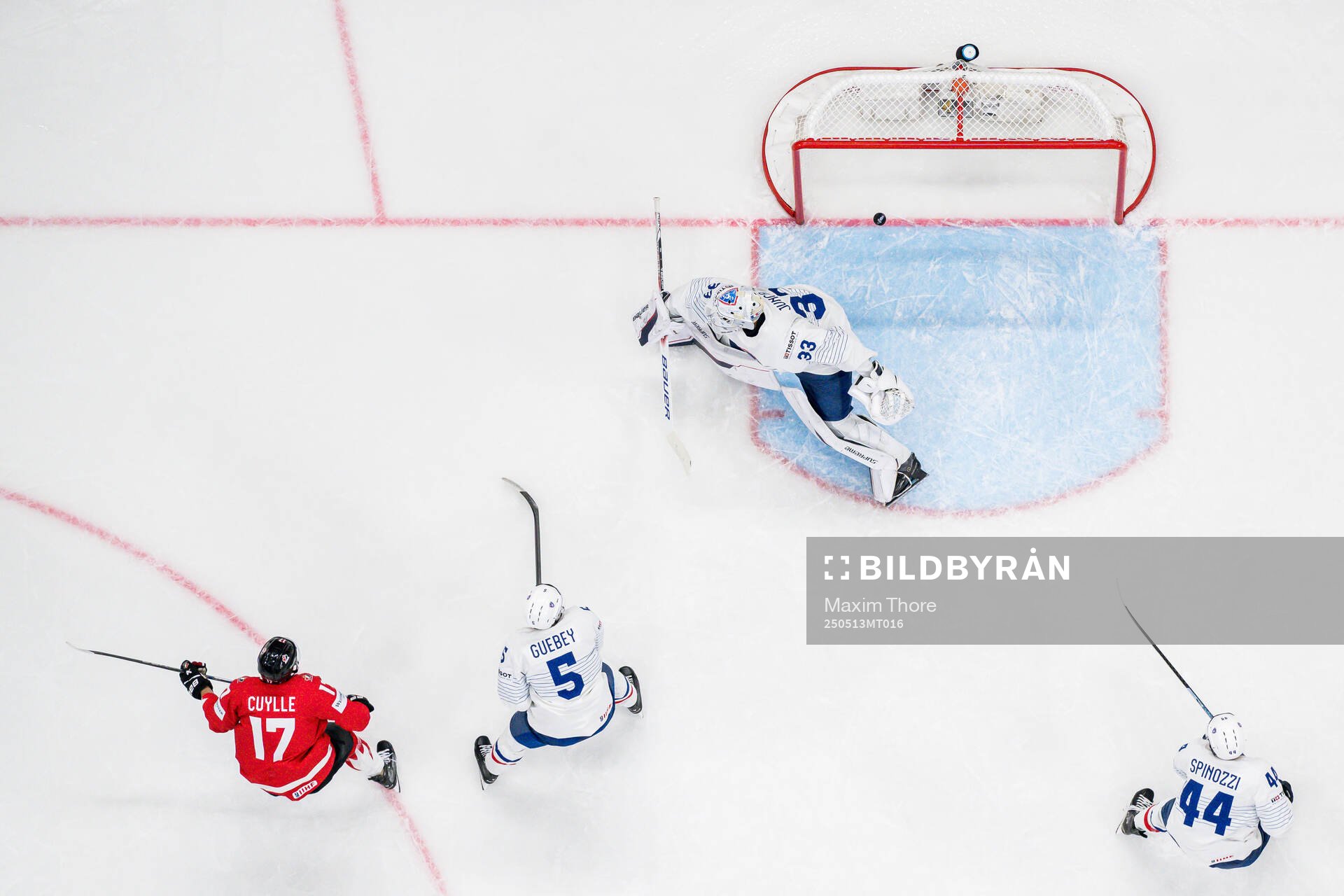 Enzo Guebey and goaltender Julian Junca of France defend