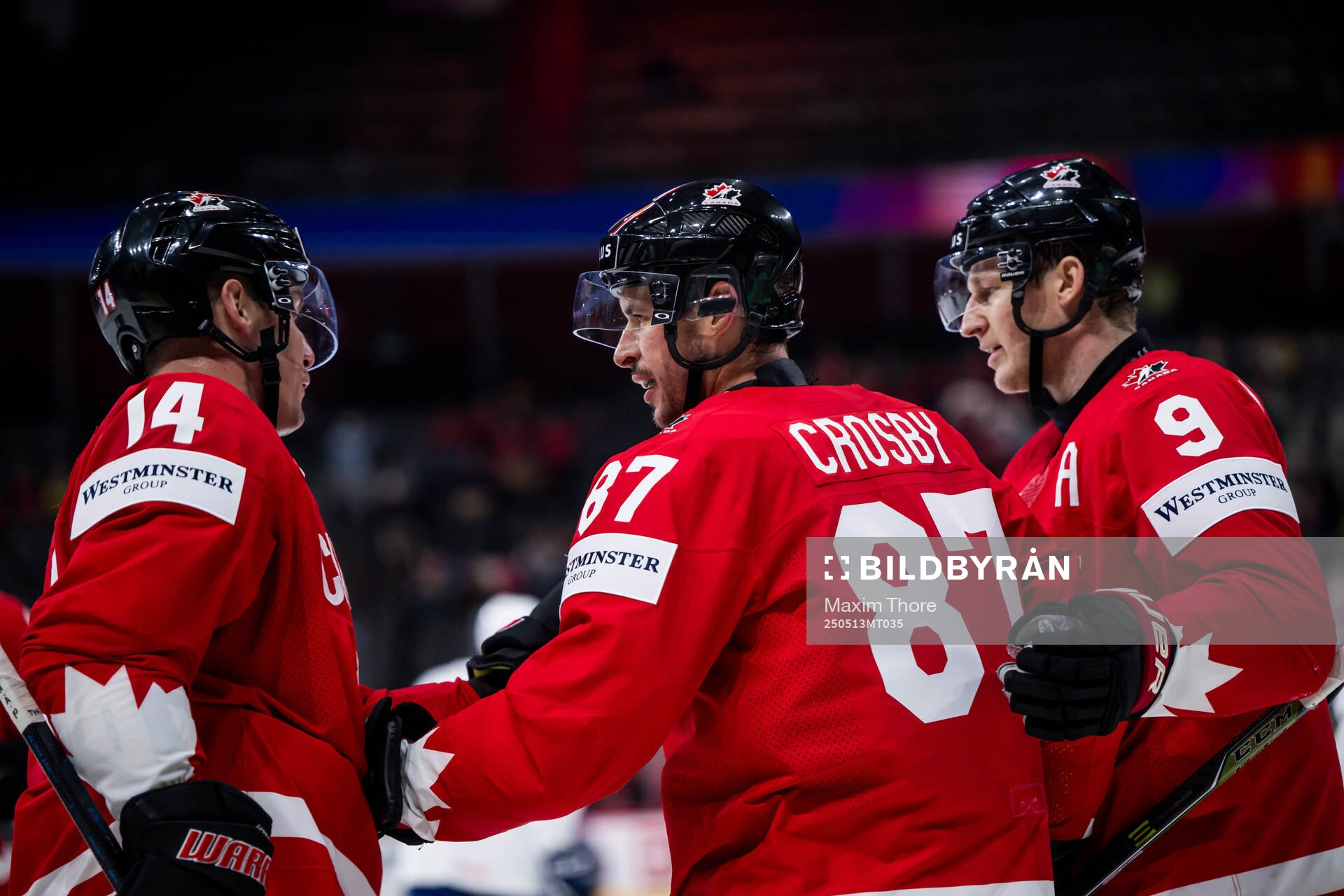 Sidney Crosby of Canada celebrates with Bo Horvat and