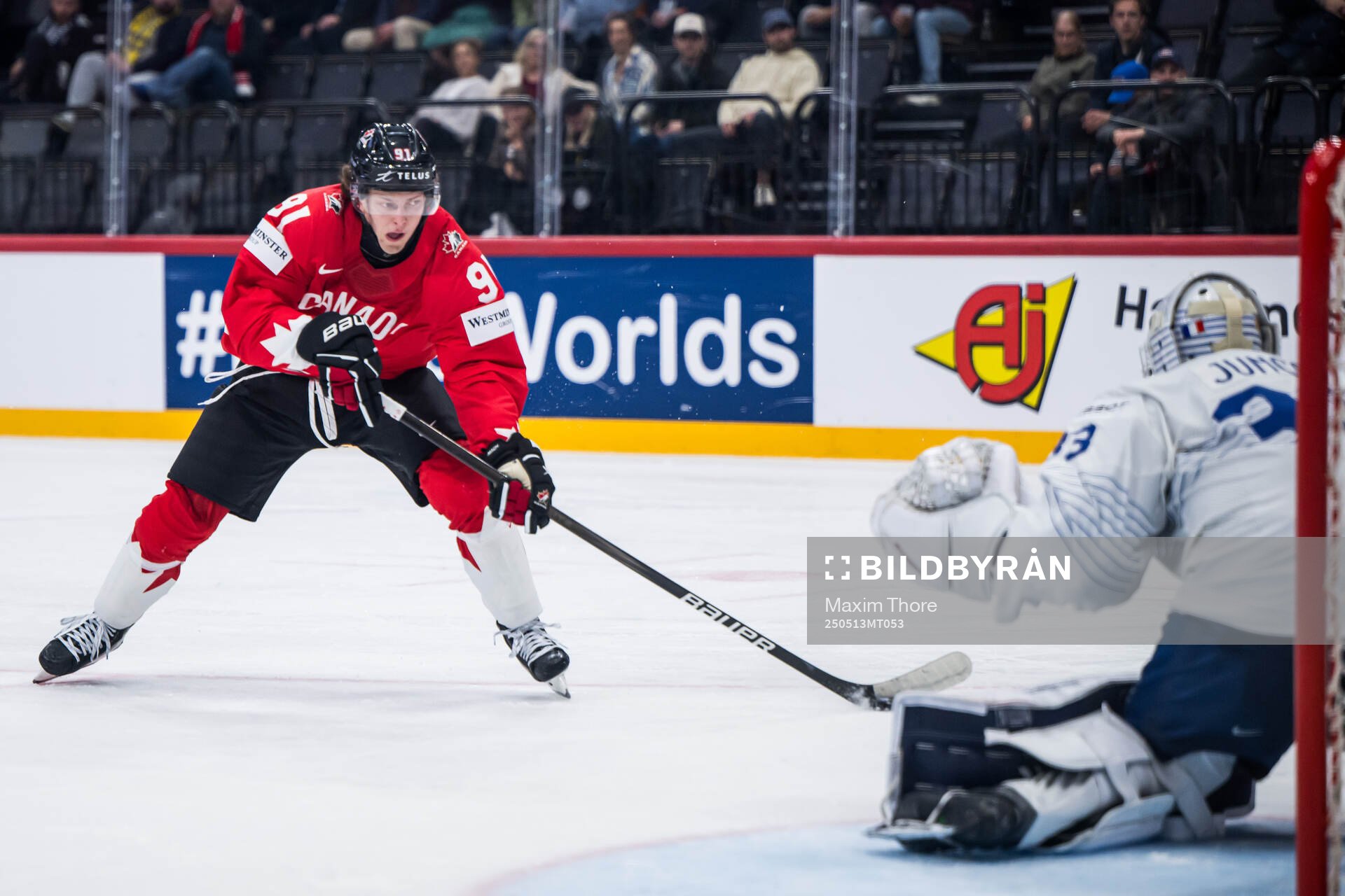 Kent Johnson of Canada and goaltender Julian Junca of France