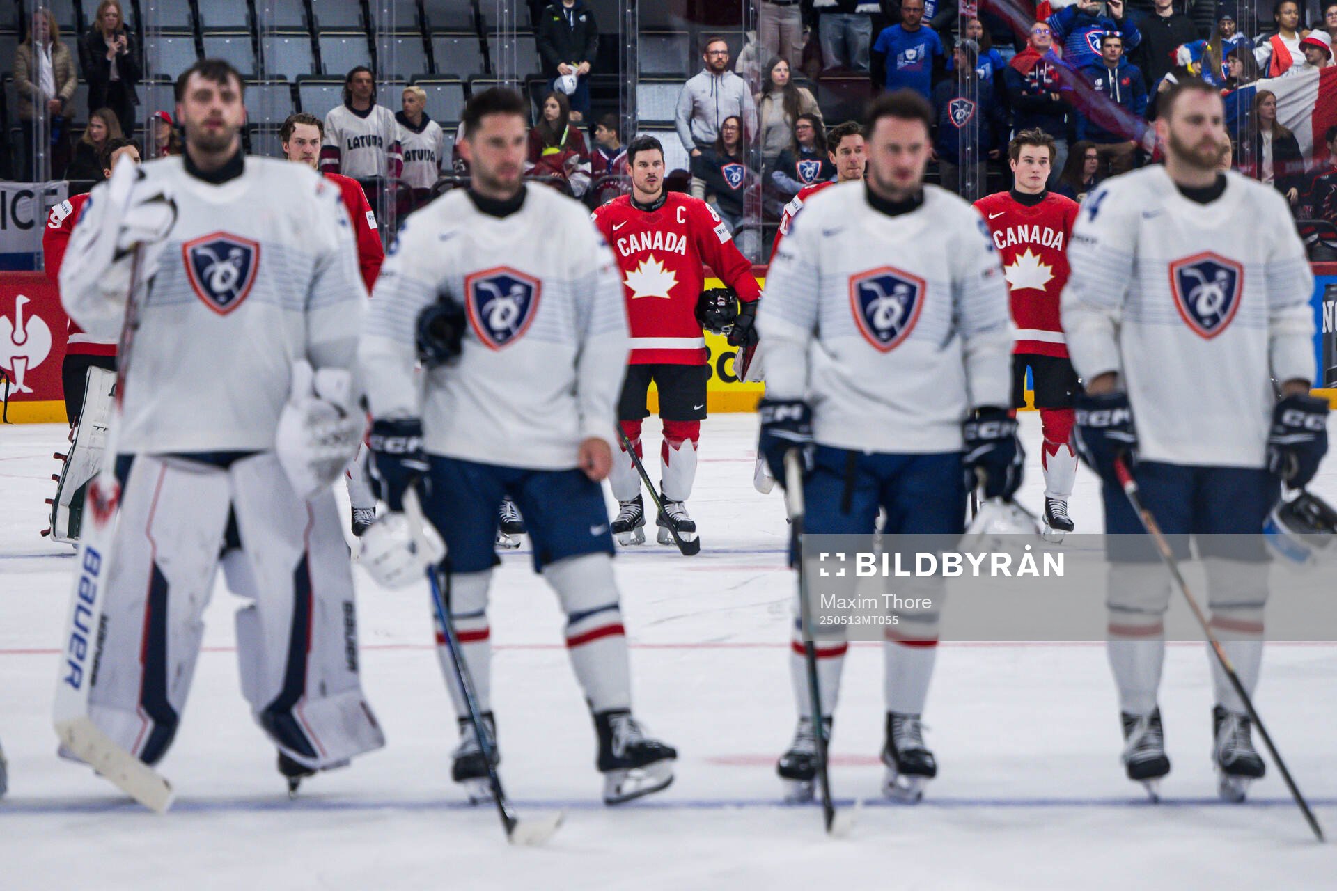 Sidney Crosby (middle) of Canada