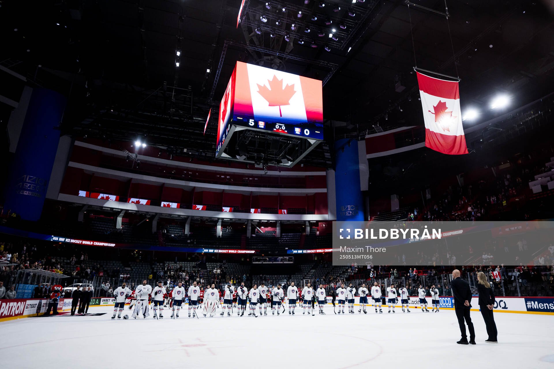 Players of Canada and of France as the flag of Canada is