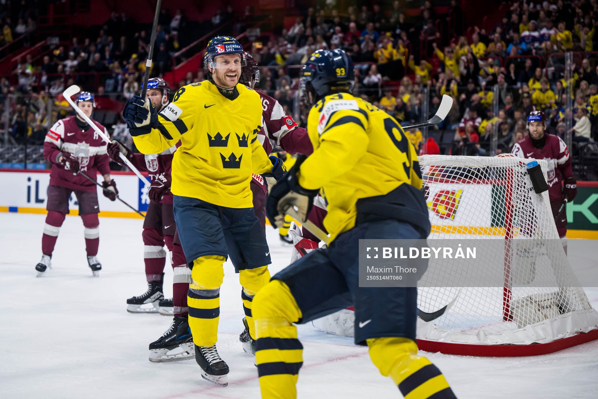 Jonas Brodin and Mika Zibanejad of Sweden celebrating the