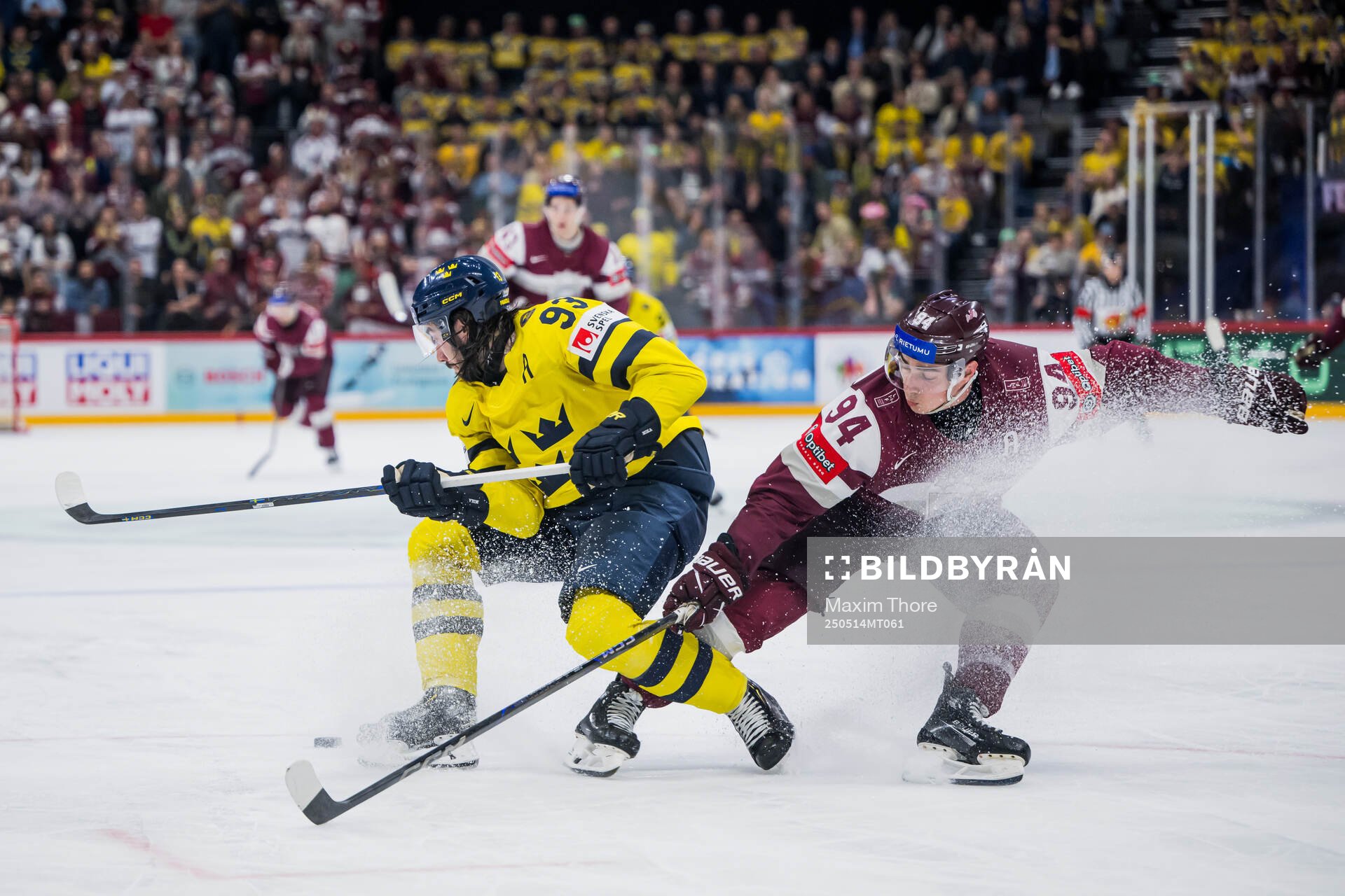 Mika Zibanejad of Sweden and Kristians Rubins of Latvia
