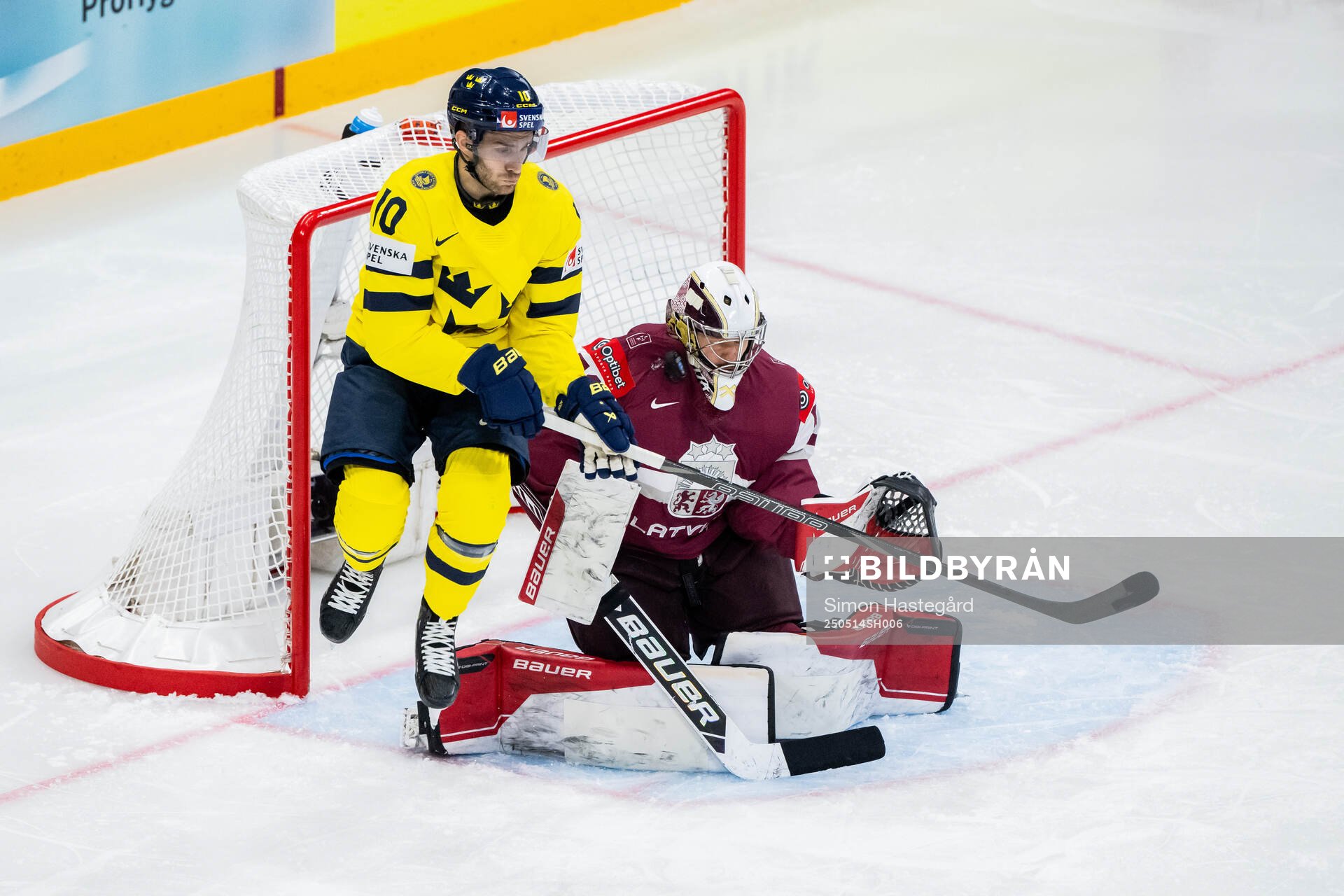 Alexander Wennberg of Sweden and goalkeeper Kristers