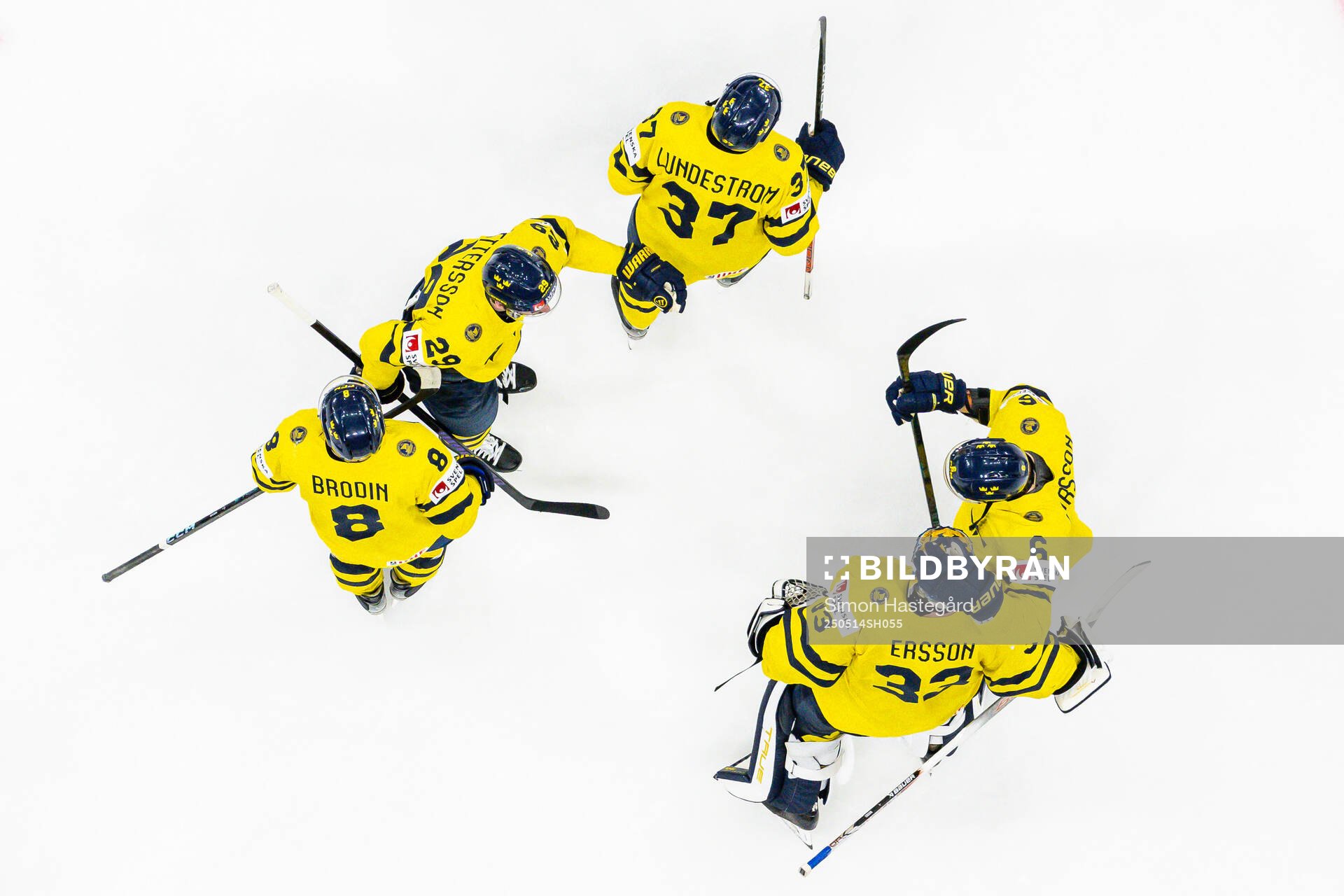 Goaltender Samuel Ersson of Sweden celebrates with teammates
