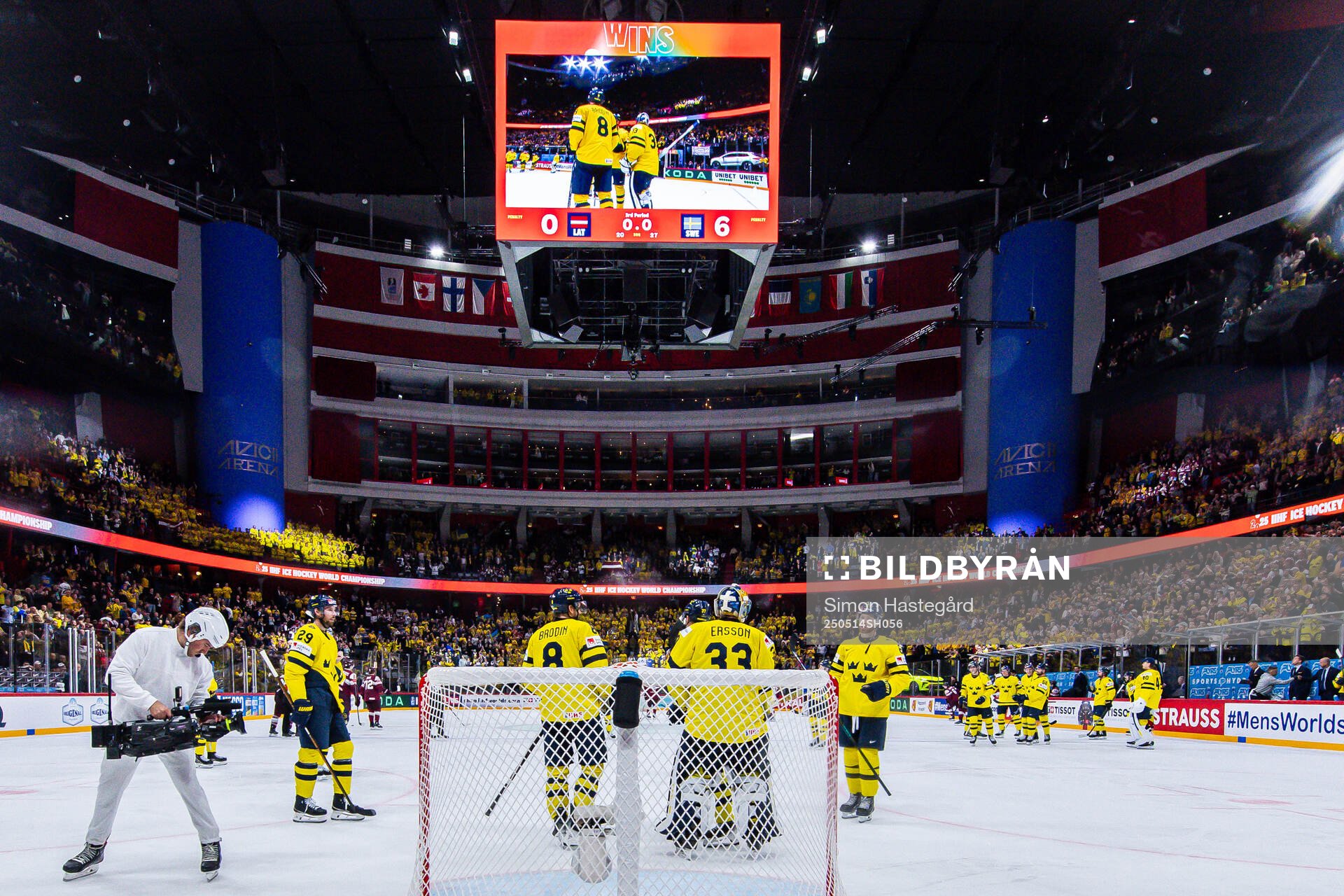 Goaltender Samuel Ersson of Sweden celebrates with teammates
