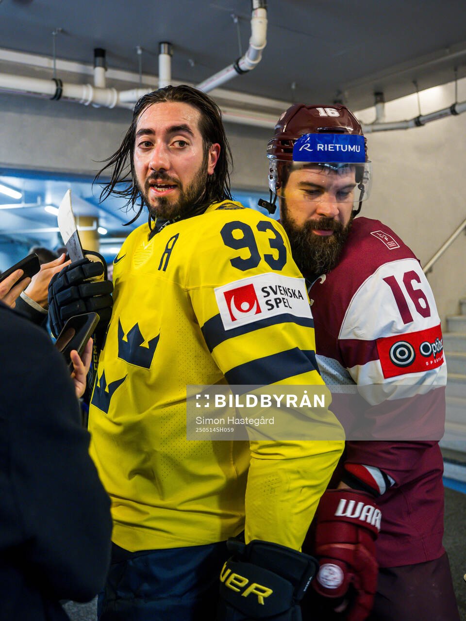 Mika Zibanejad of Sweden and Kaspars Daugavins of Latvia