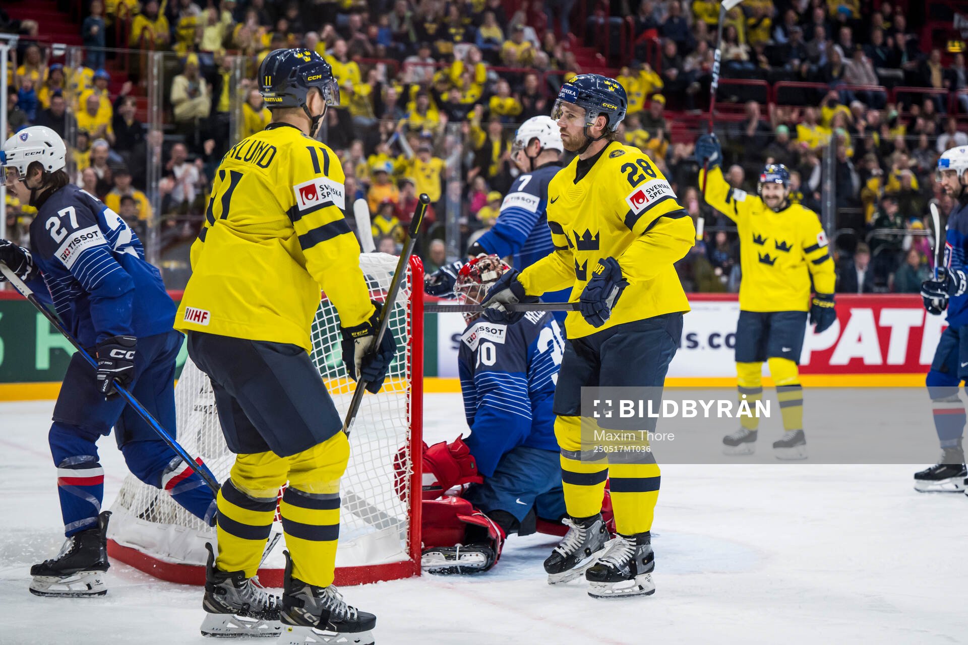 Mikael Backlund and Elias Lindholm of Sweden celebrate