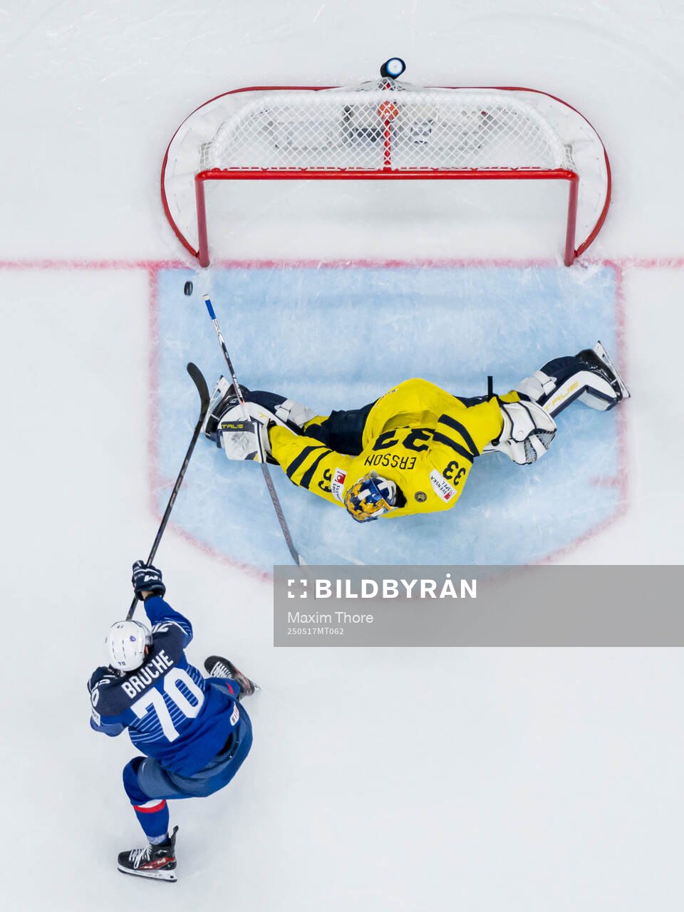 Baptiste Bruche of France and goaltender Samuel Ersson of