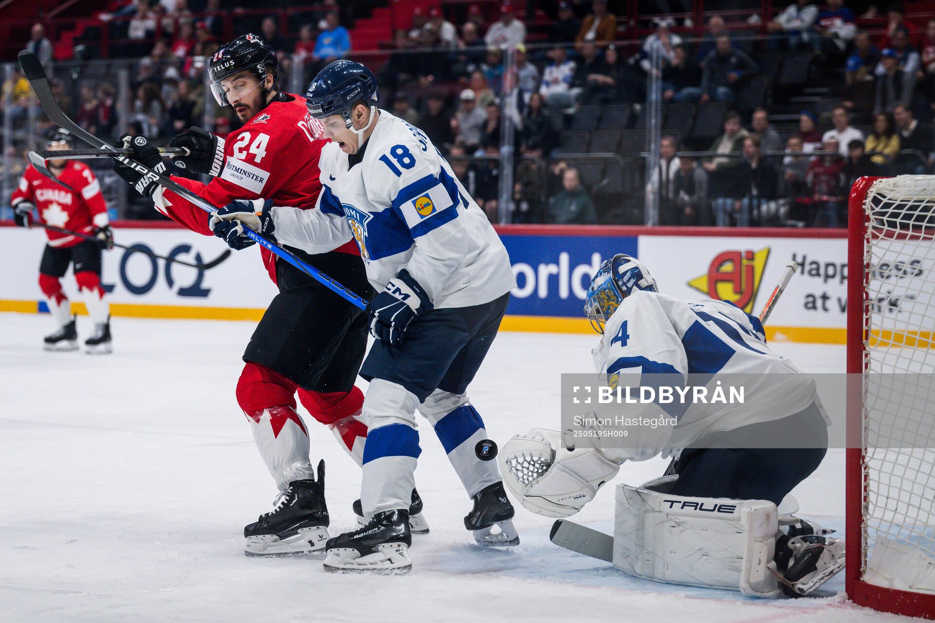 Phillip Danault of Canada against Vili Saarijärvi and