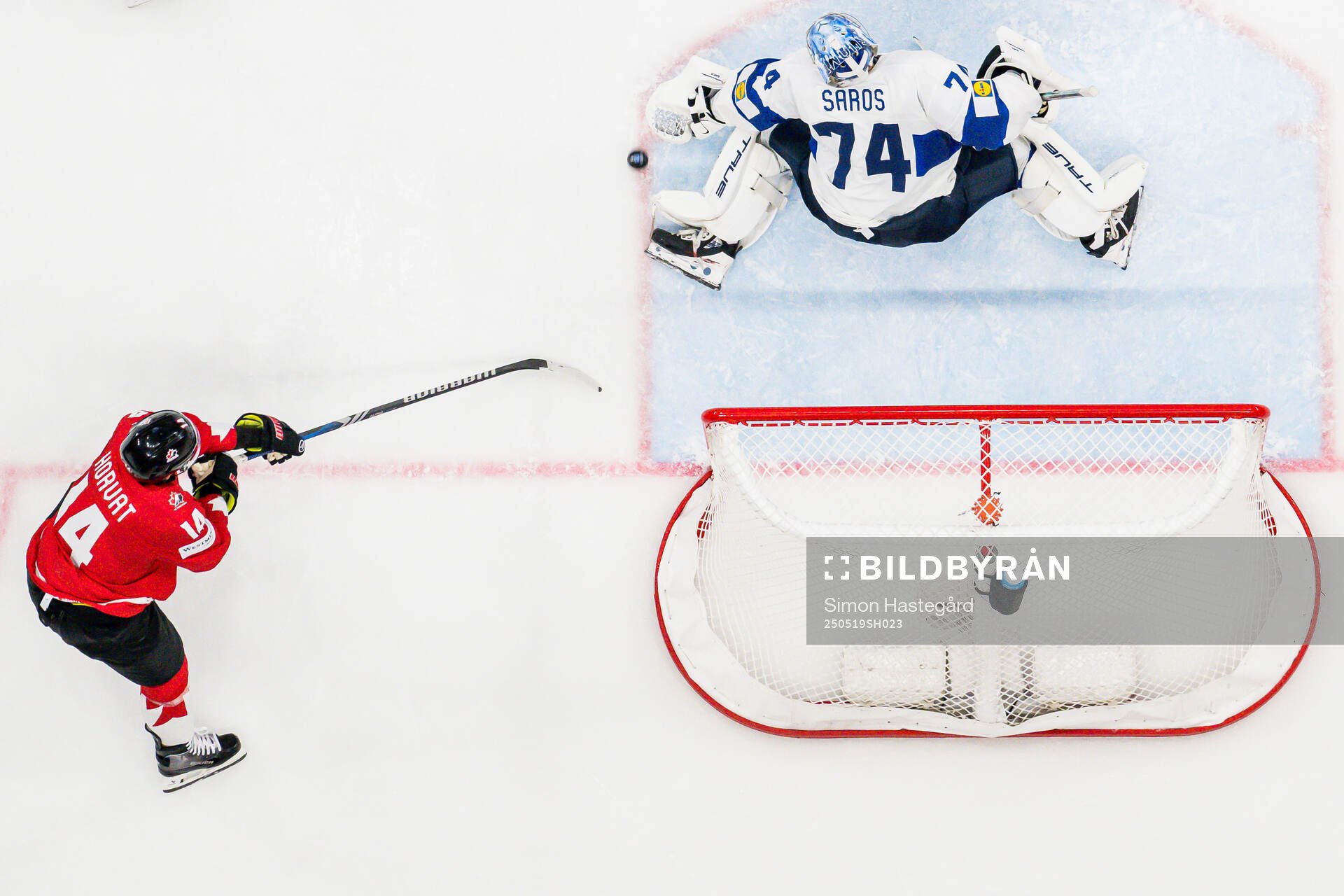Bo Horvat of Canada and goaltender Juuse Saros of Finland