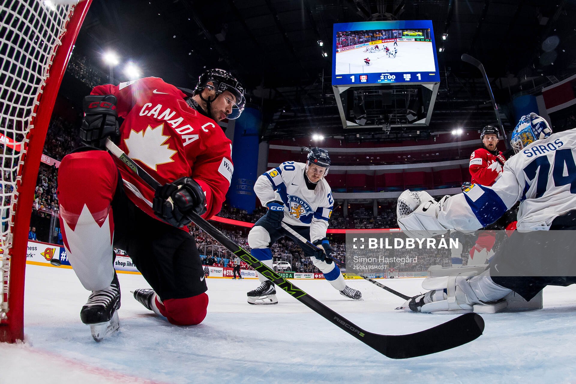 Sidney Crosby and Nathan MacKinnon of Canada against Eeli